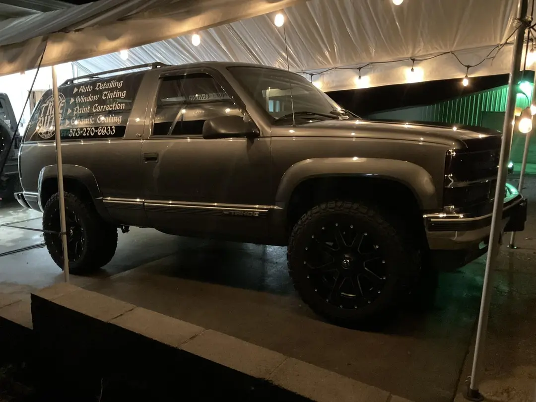 Gray car with text on its back window