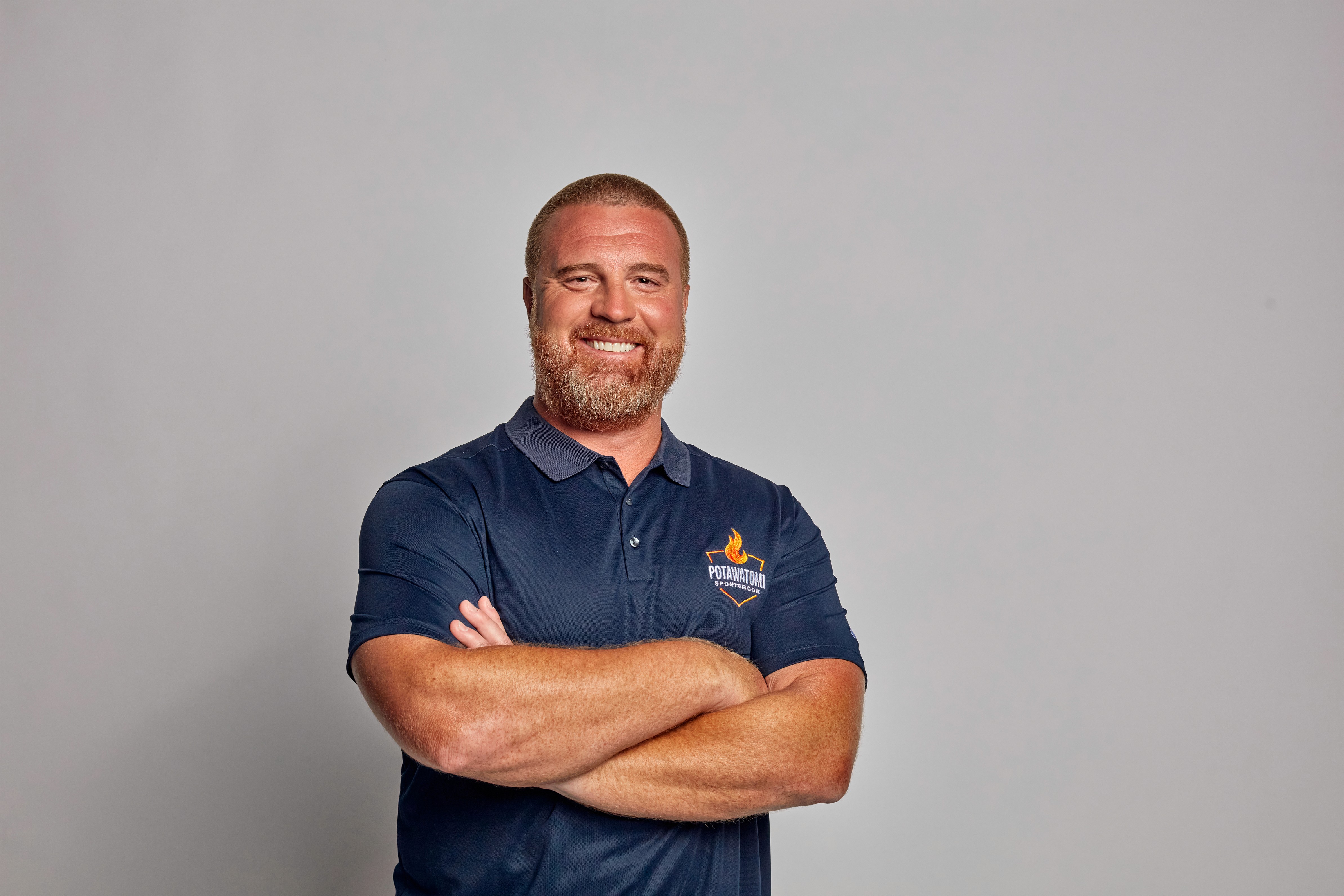John Kuhn poses against a plain backdrop