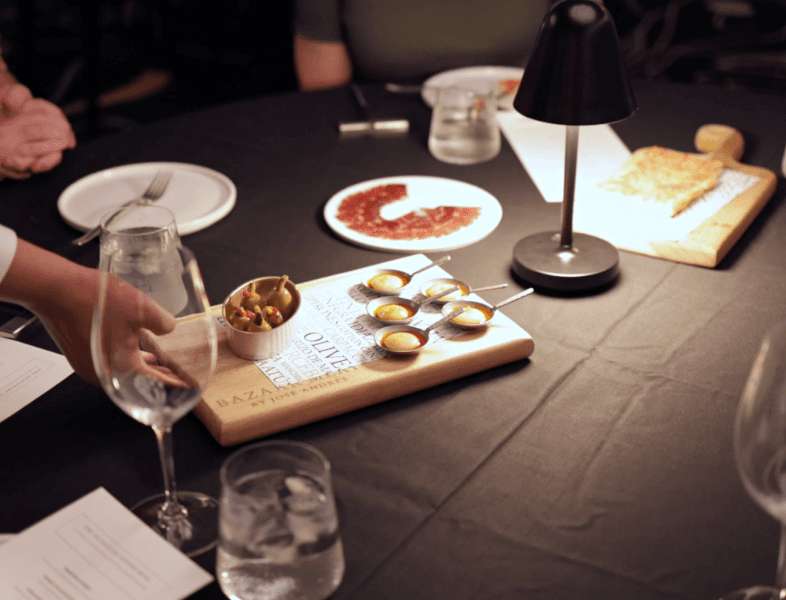 Image of a dinner table with appetizers