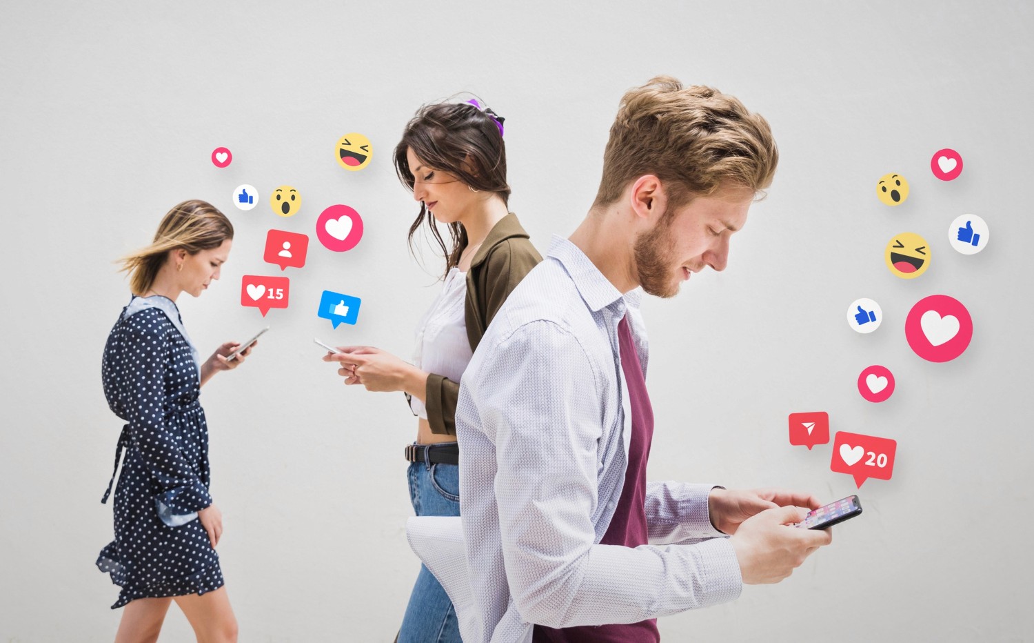 A diverse group of individuals poses in front of a wall adorned with various social media icons.