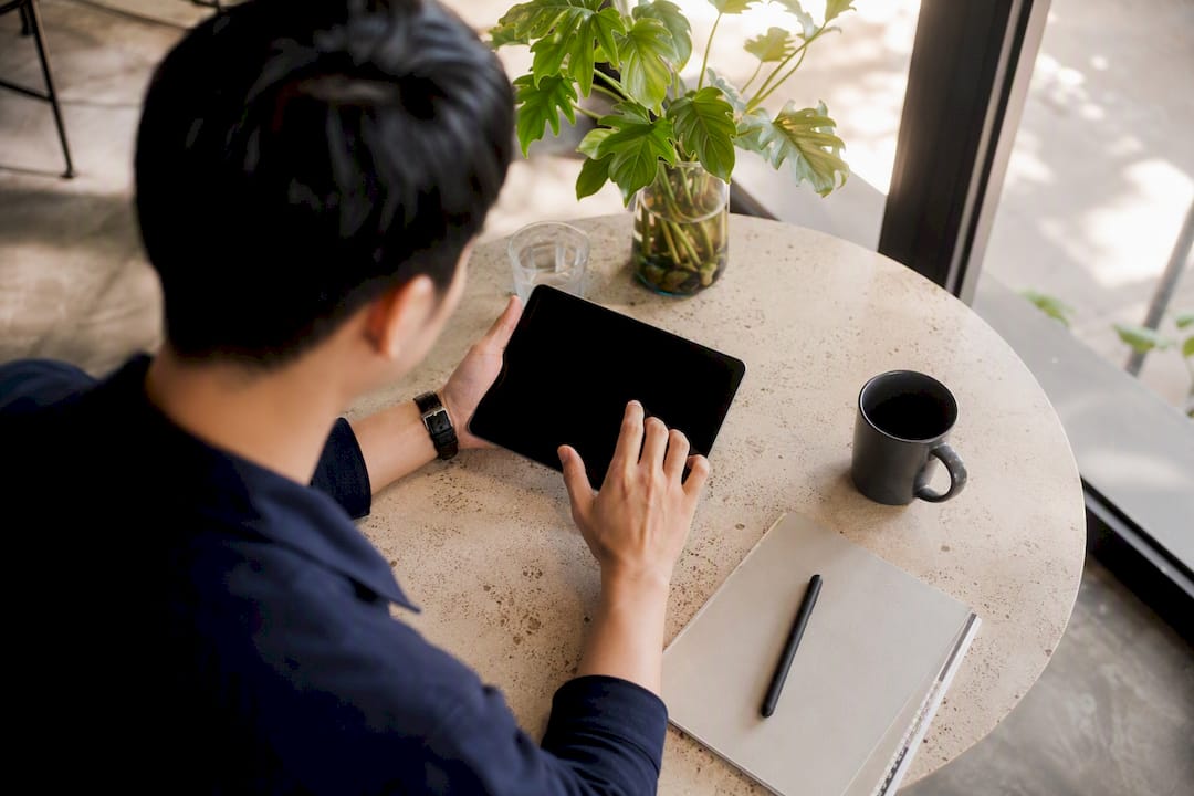 Hands creating new pipeline entries on tablet