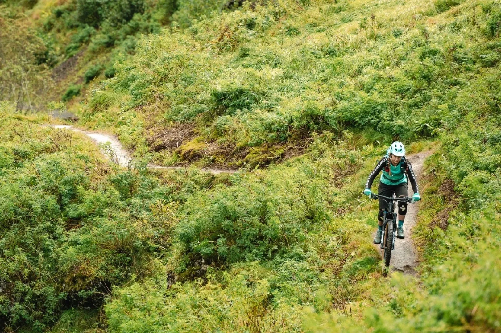 One person rides towards camera