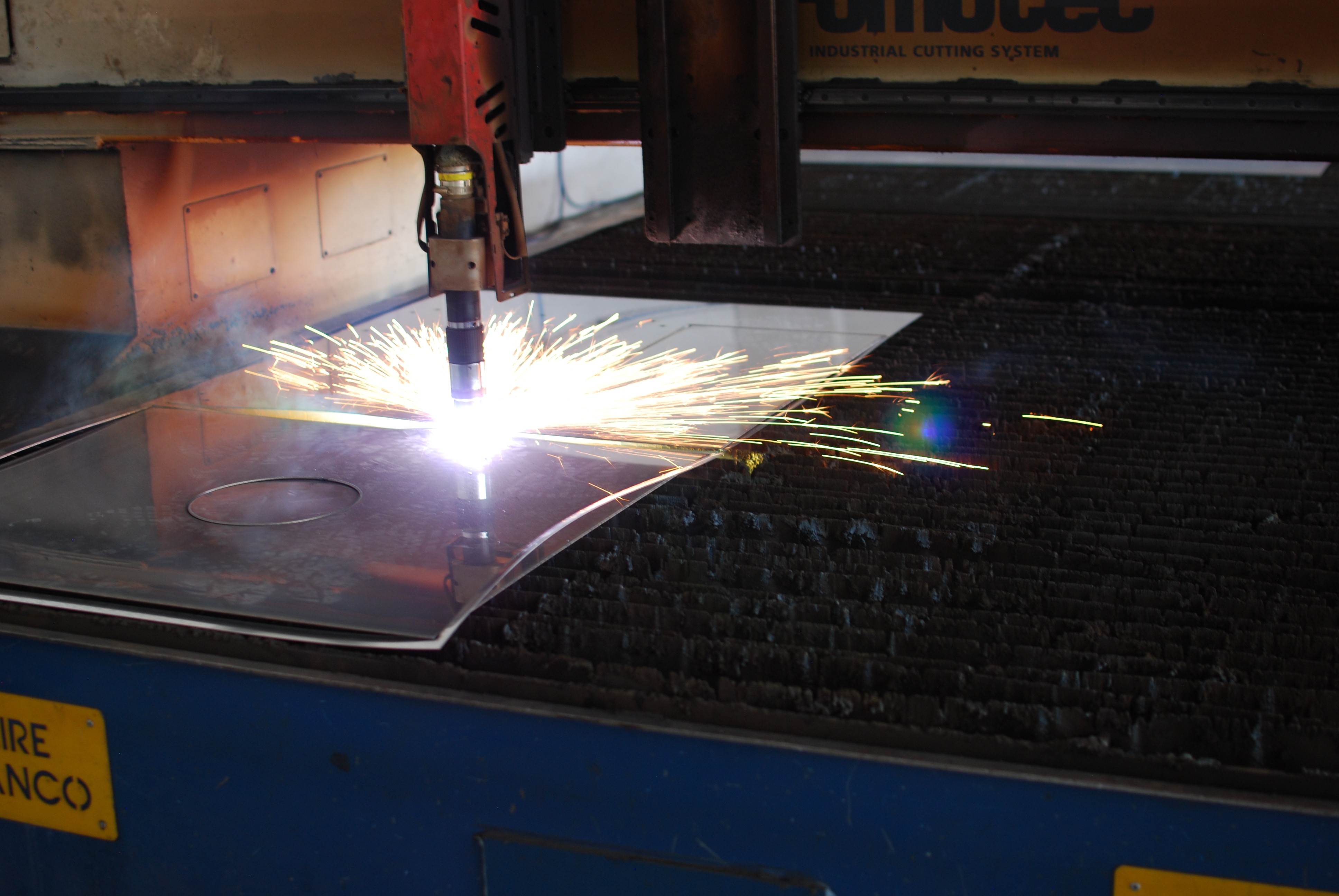 Welding sparks illuminate the darkness.