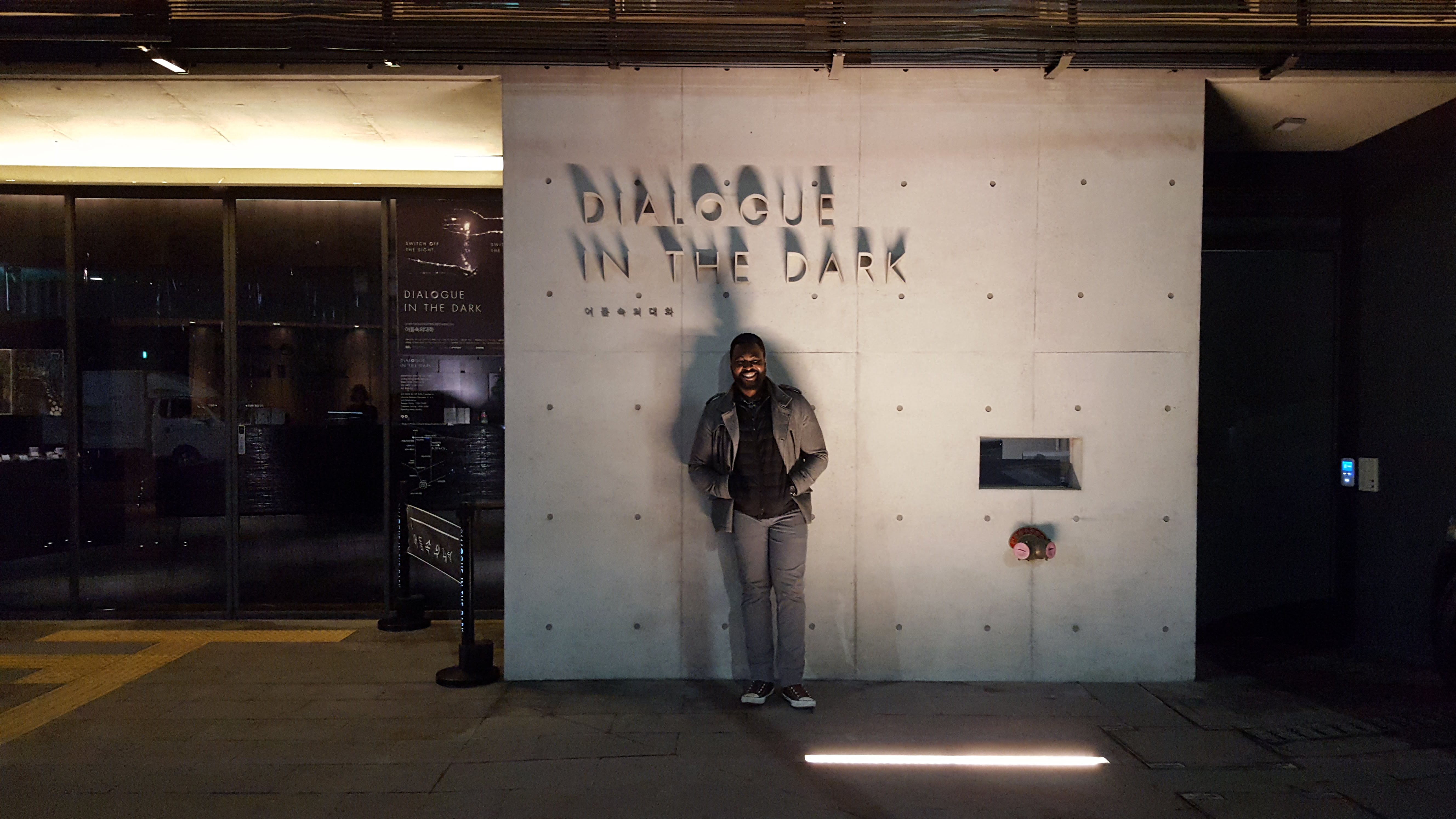 man standing in front of a building