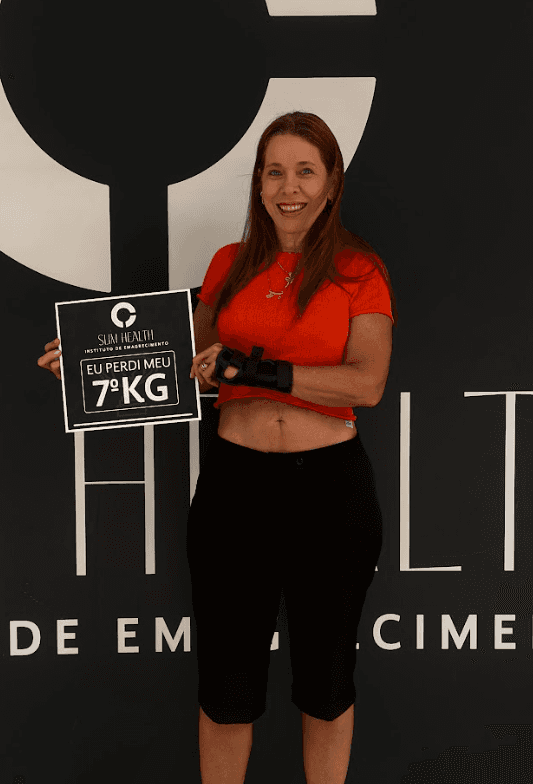 Close-up of a tree stump showing growth rings and a textured brown wood surface.