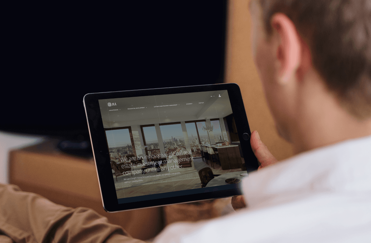 A mockup of a Macbook on a sofa