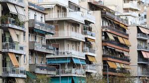 Greek residential buildings in winter reflecting the difficulty of keeping homes warm and the burden of rising housing costs.