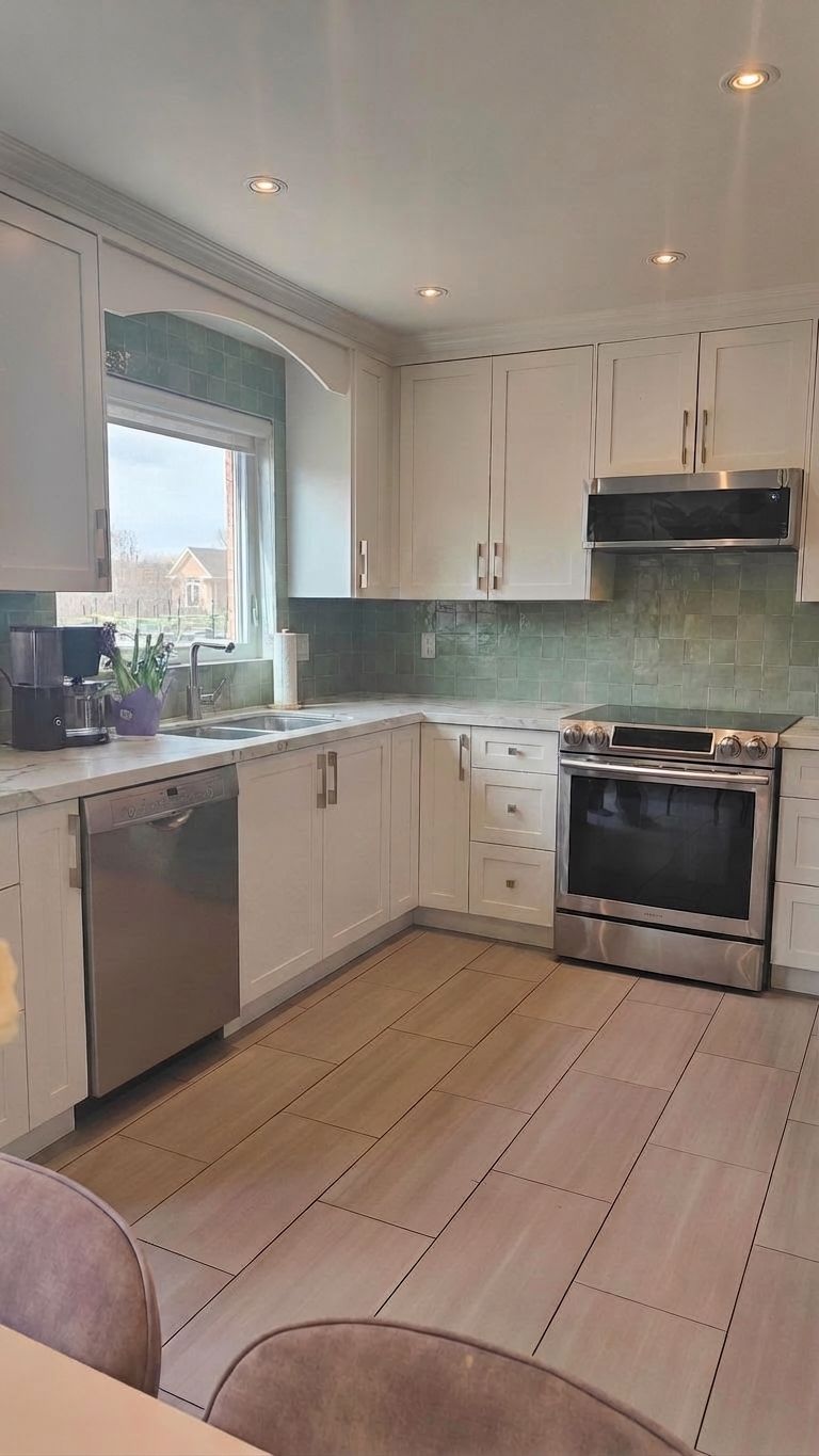 Direction D refined — white painted lowers, sage green zellige backsplash, and white marble countertops with gray veining