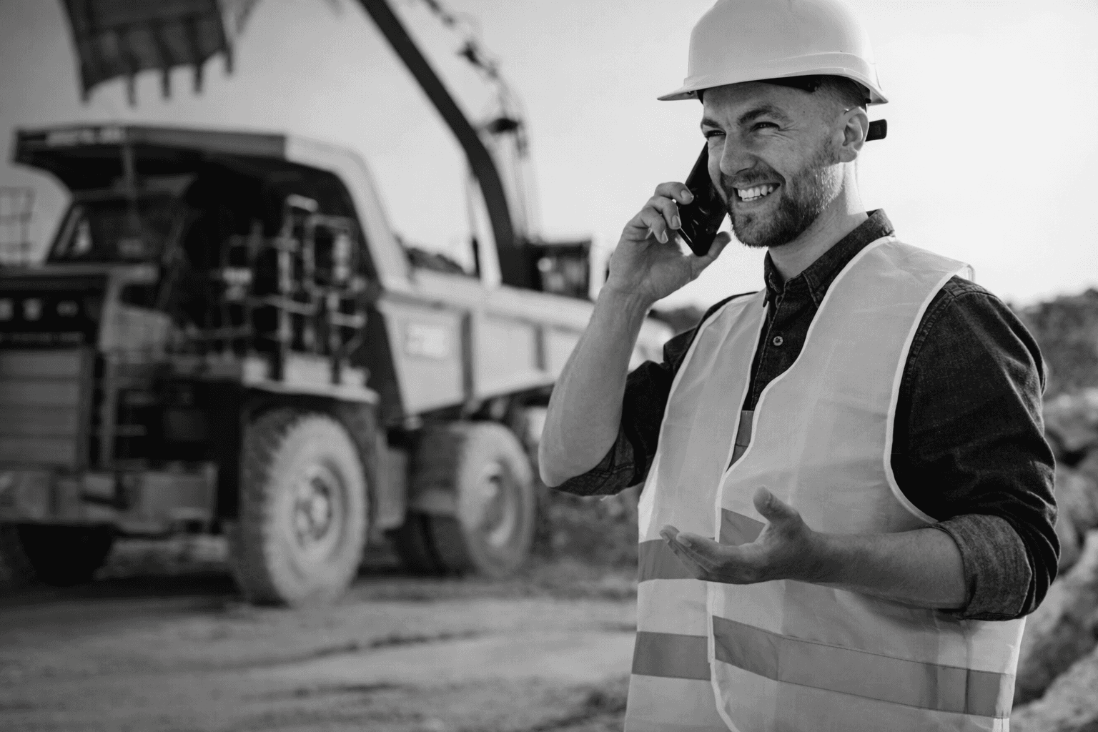 man in blue jacket wearing orange helmet