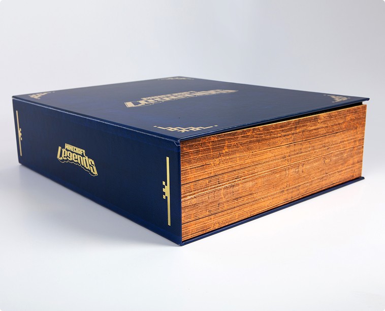 Closeup of the influencer kit packaging, styled as an old book with gold edged pages