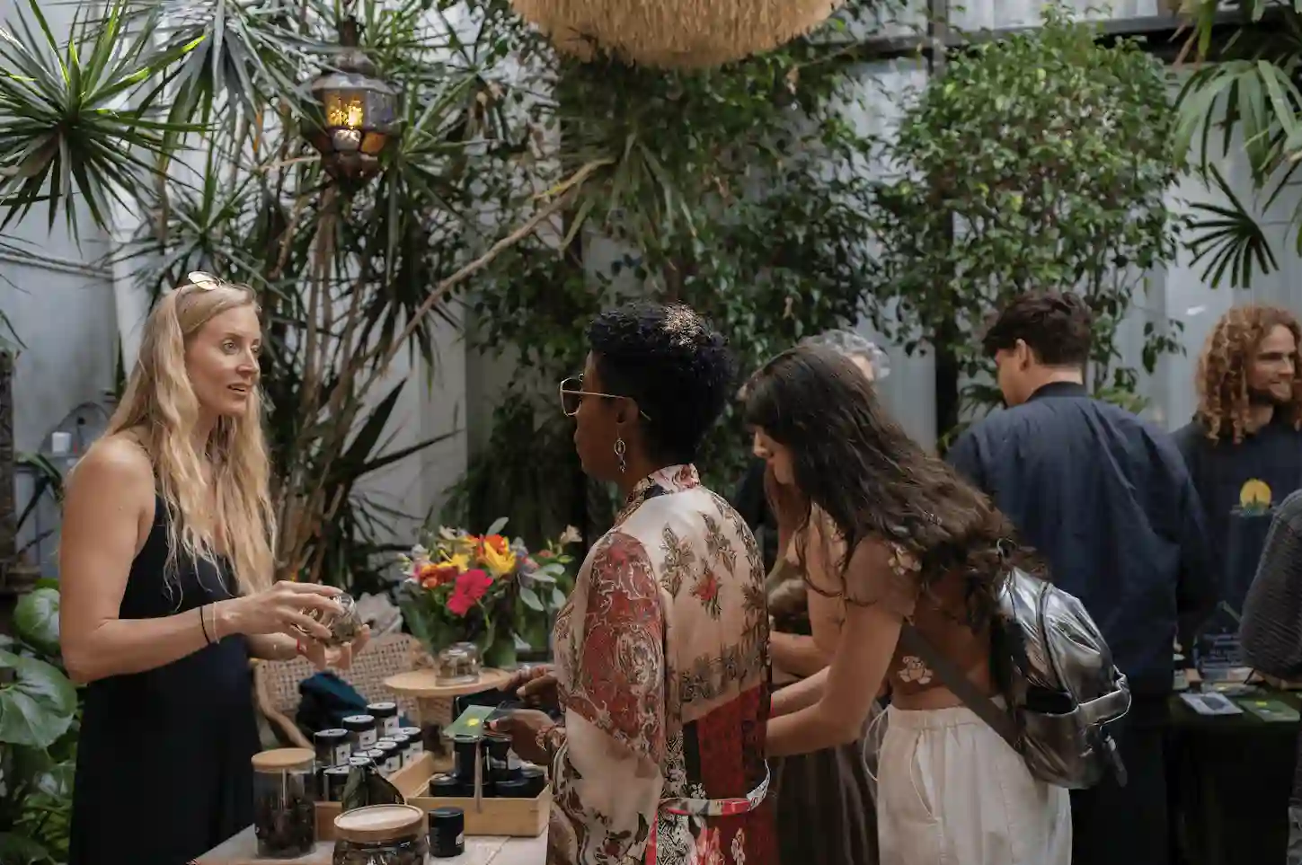 Worker at the Woods WeHo talking with customers.