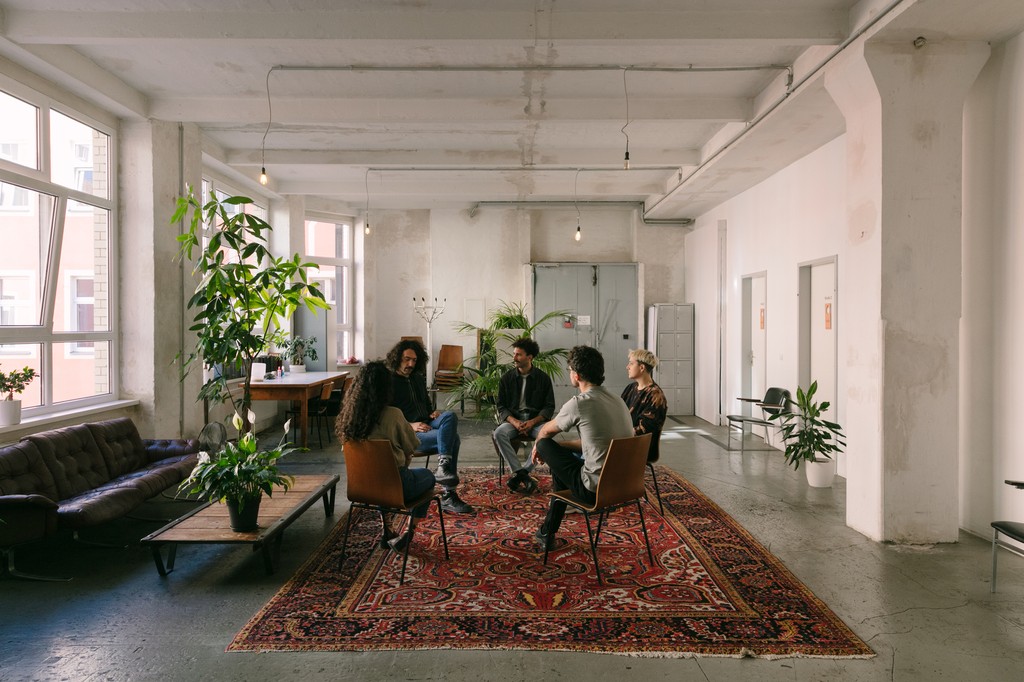 interns in a room having a conversation