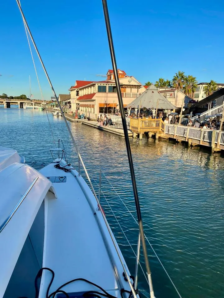 Shem Creek restaurants and docks seen from the bow of the hosts’ catamaran