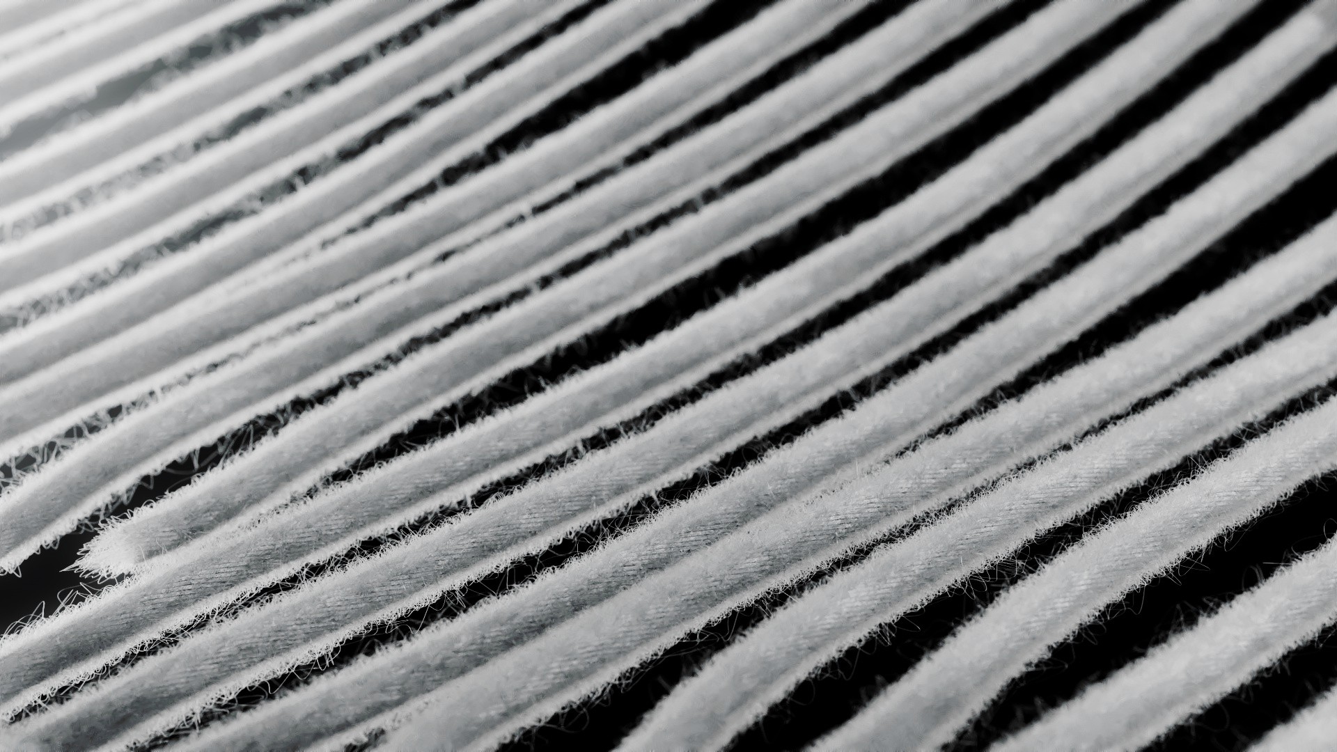 Detailansicht einer gerenderten Strickstruktur mit parallelen Faserverläufen und gleichmäßigem Maschenraster