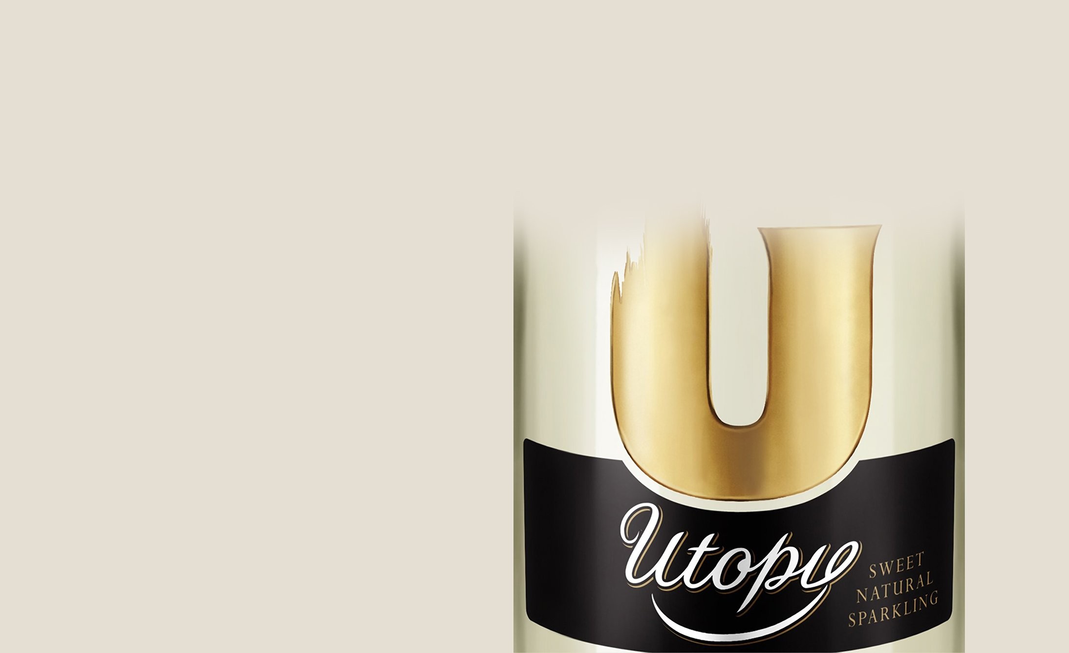 Partial view of a bottle with a sleek design. It features a large, gold letter "U" above the word "Utopia" in elegant script on a black label, conveying a sense of luxury and sophistication.
