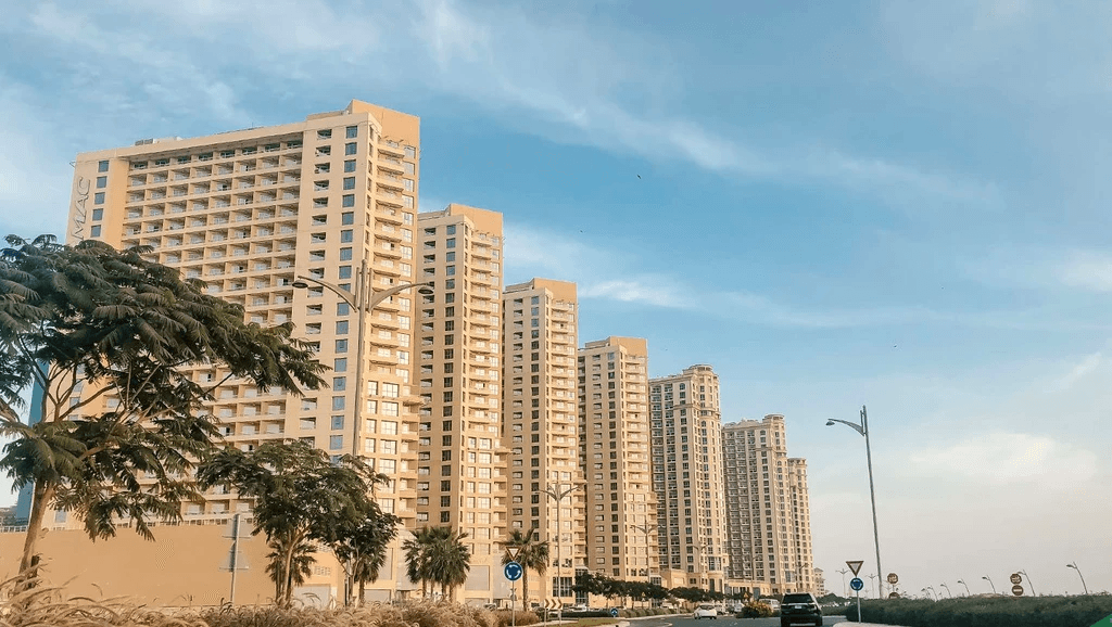 An empty road with tall buildings, including Lakeside Tower, visible in the background.