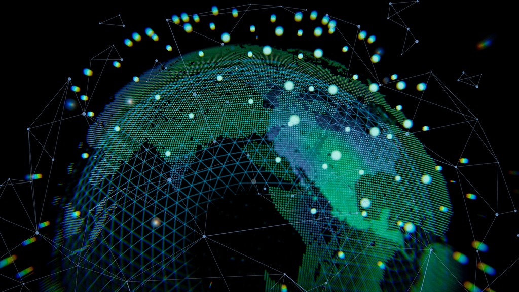 Man with a laptop walking to a store