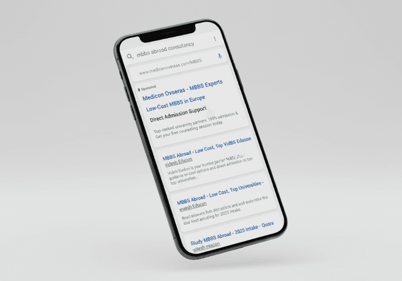 Smartphone mockup displaying a Google Search ad with compelling copy for Medicon Overseas' MBBS consultancy.