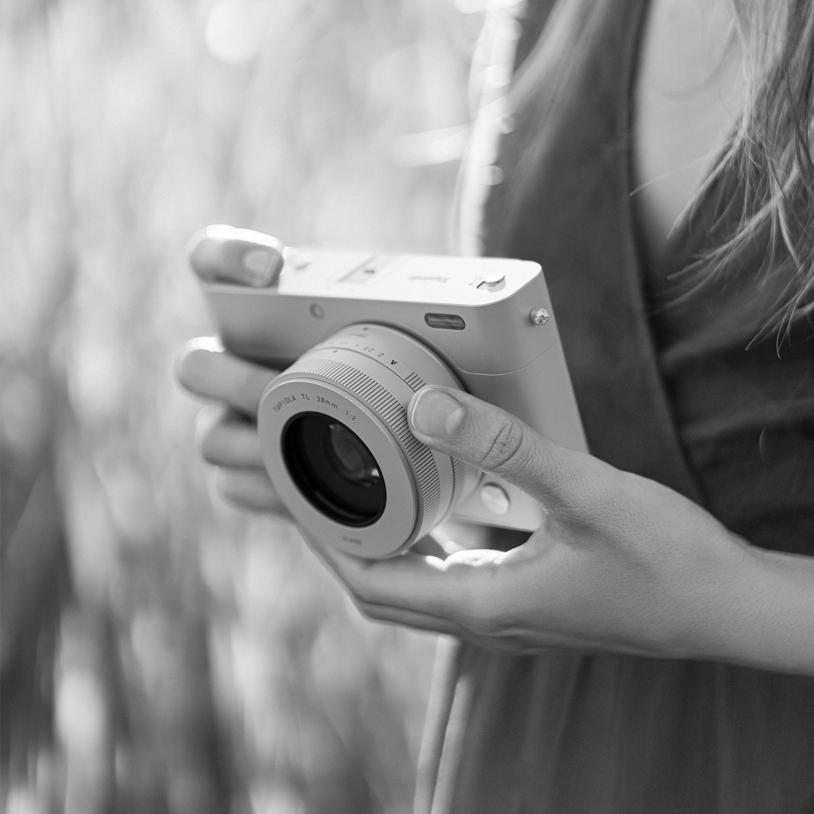 A digital camera Tapiola One in a womans hands