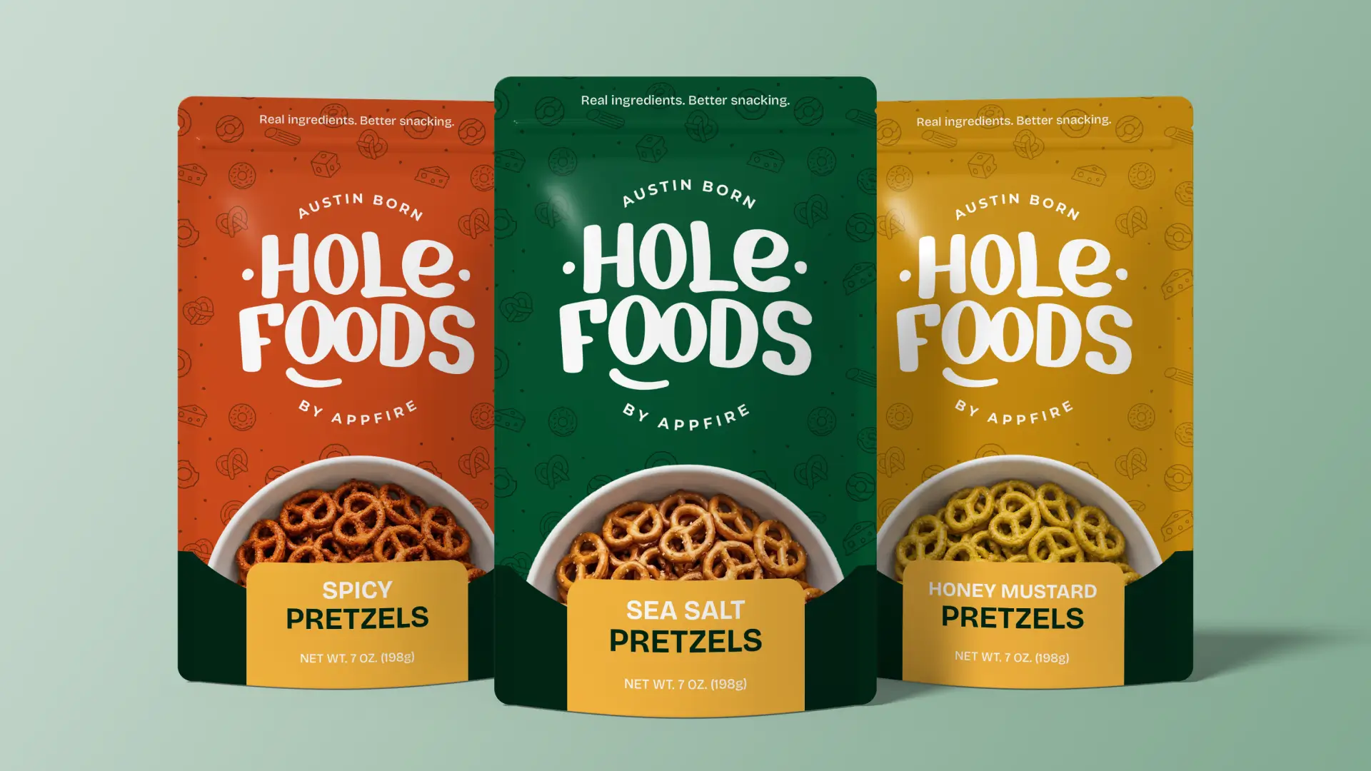 Three Hole Foods pretzel snack pouches in orange, green, and yellow, each with a bowl of pretzels on the front.