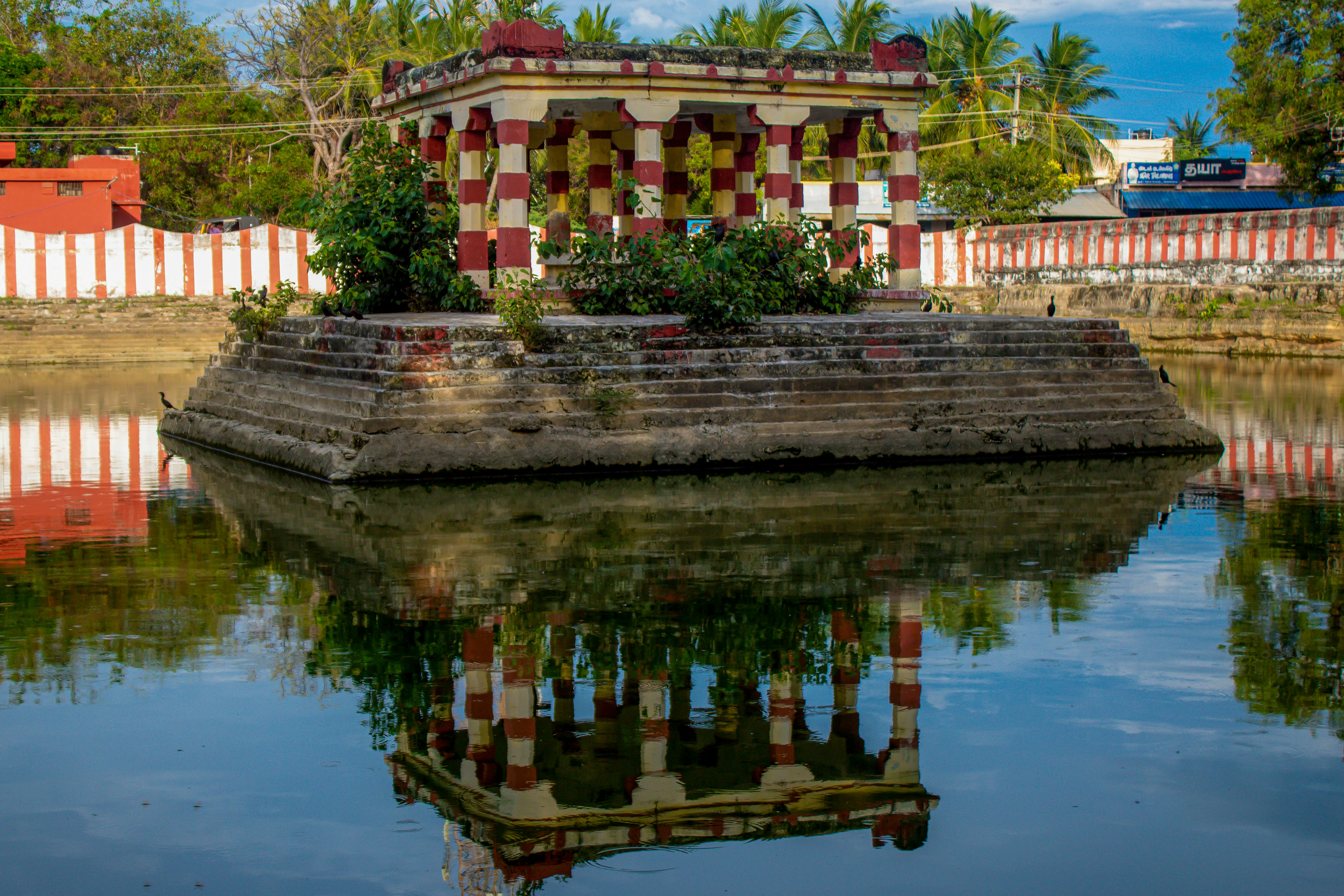 a building sitting on top of a body of water