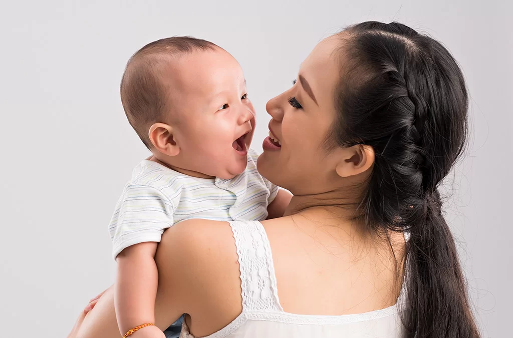 Woman with baby CoQ10