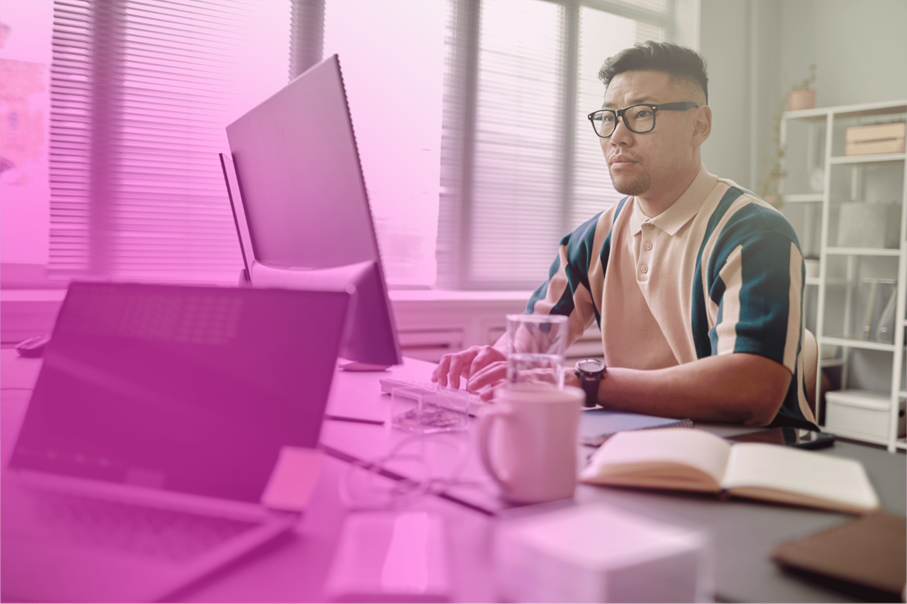 Image featuring a greyscaled website on an abstract background.