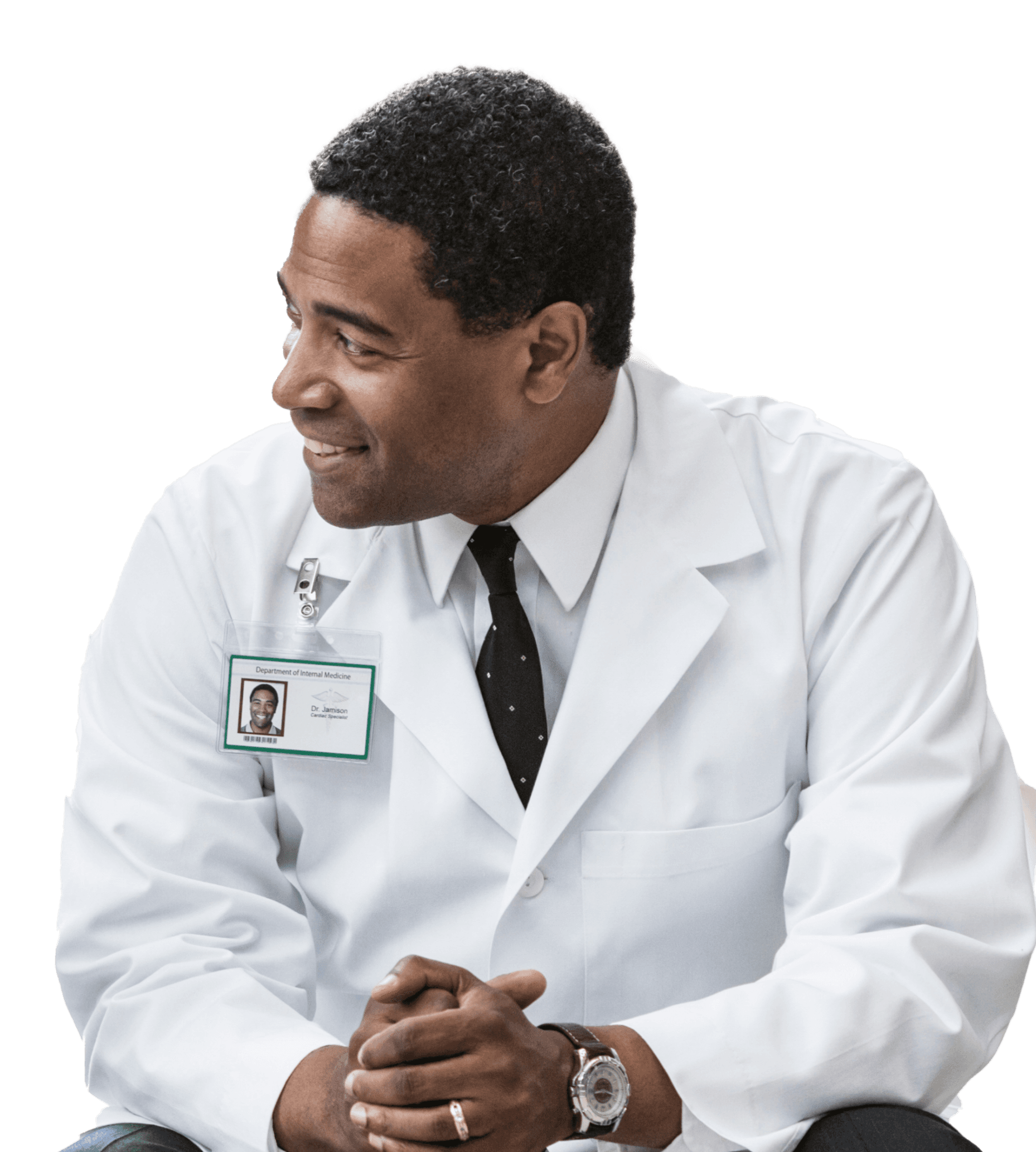 A male doctor in a lab coat smiling 