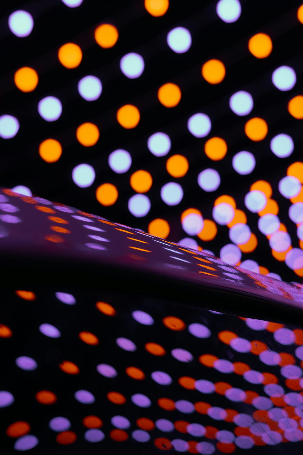 Colourful and vibrant image of a human interacting with technology.