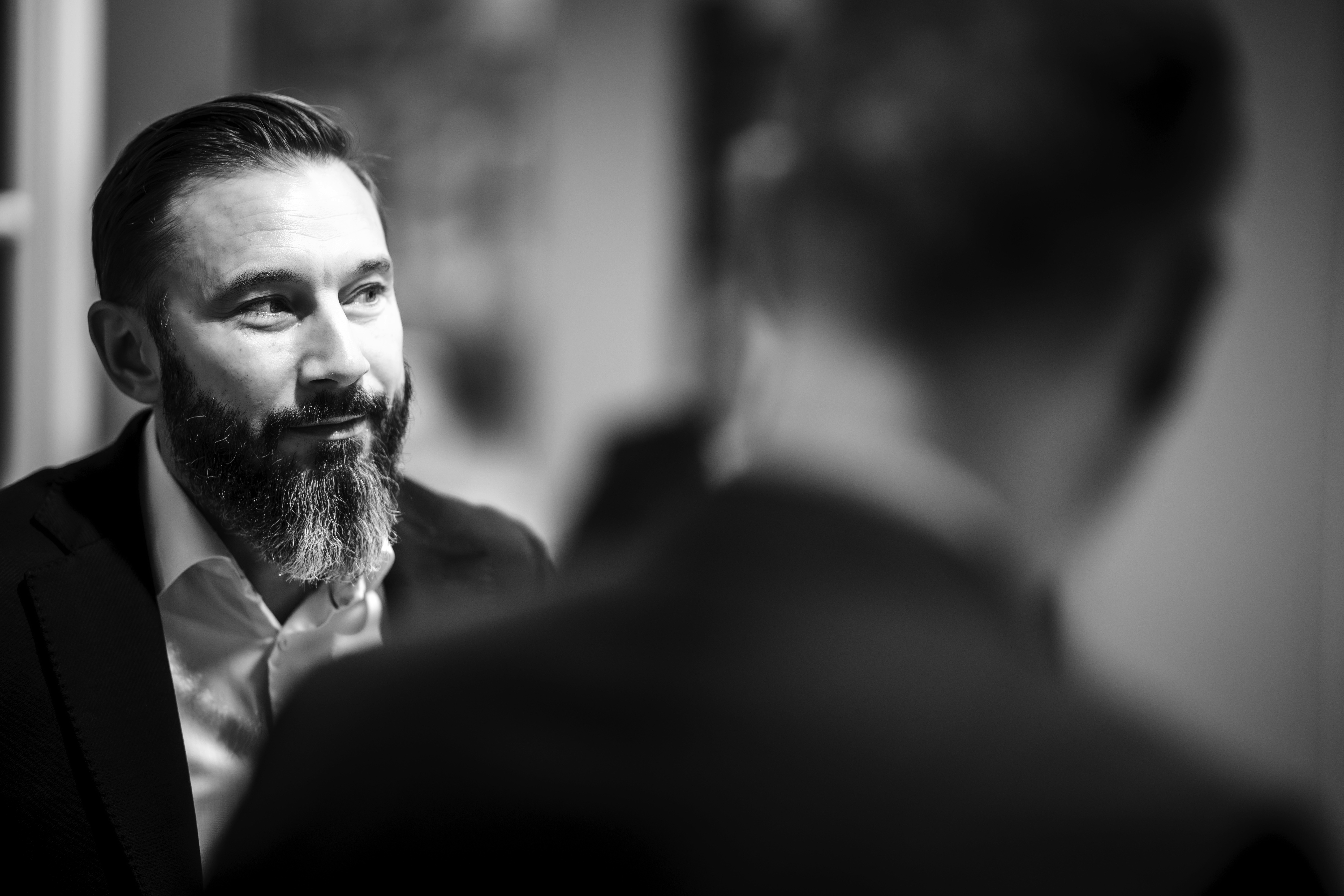 a man in a yellow shirt is on a red track