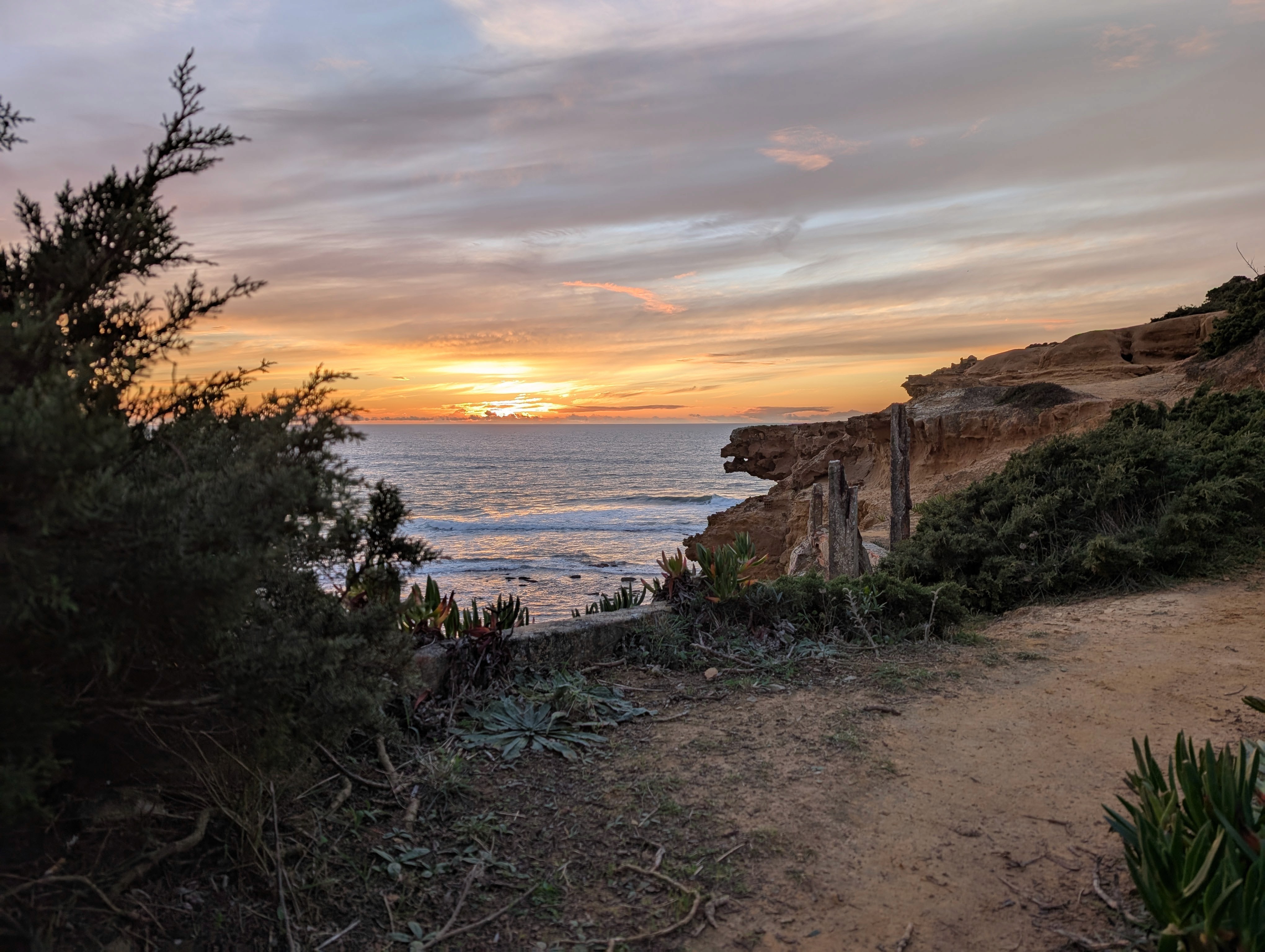 View of the beach from a cliffside in Ericeira, Portugal
