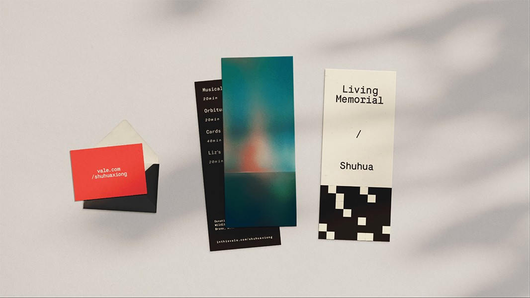 Three vertical rectangular bookmarks are arranged on a white surface. The leftmost bookmark is red with the text "Vale.com/shuhuaxiong". The center bookmark is teal with a blurred, abstract image. The rightmost bookmark is white with the text "Living Memorial / Shuhua" and a black and white geometric pattern at the bottom.