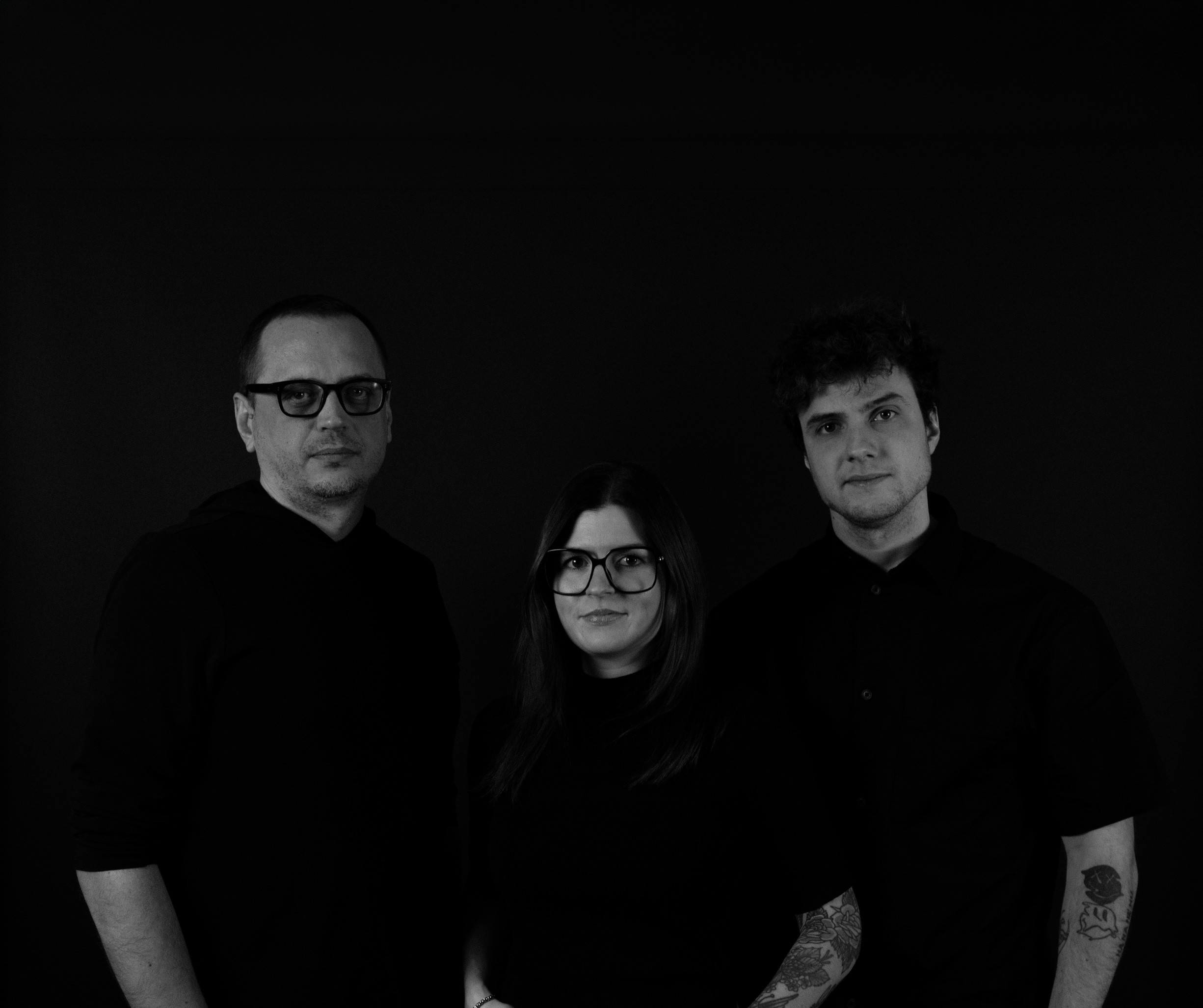 People celebrating, red stickers floating in the air