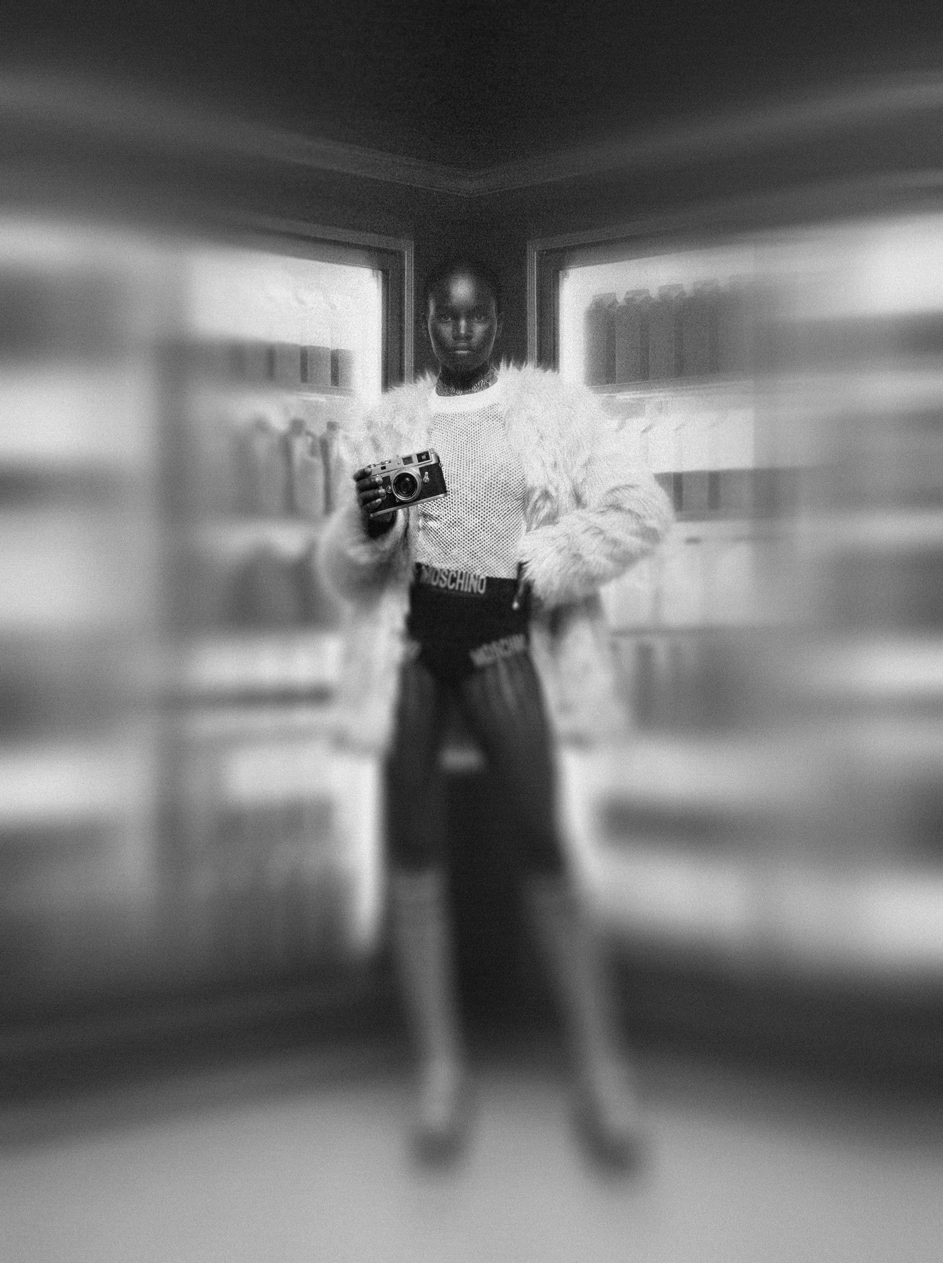 model girl holding a Leica camera