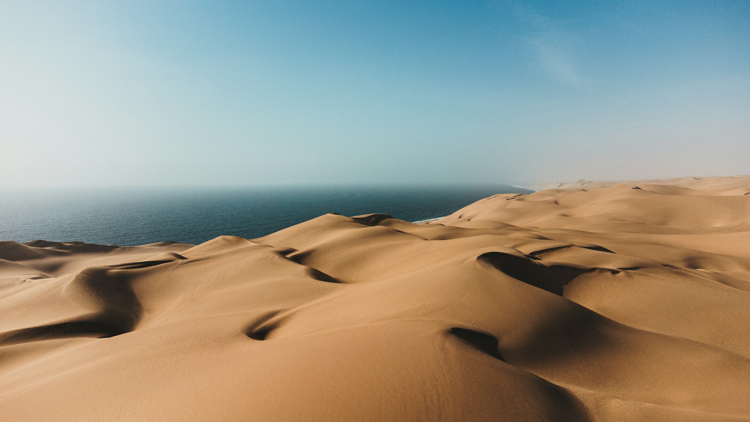 Dunes meeting the ocean at Sandwich Harbour