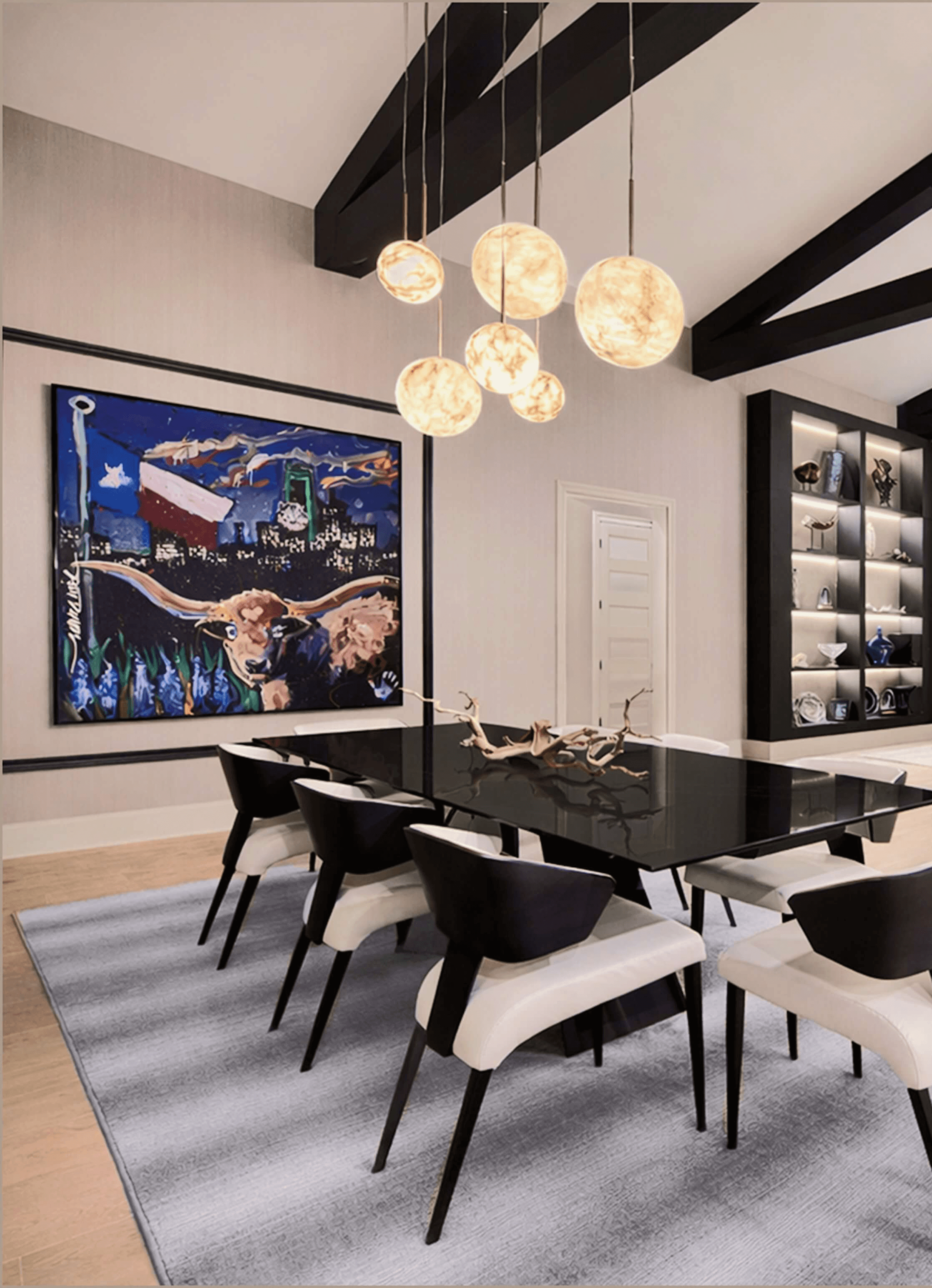 Elegant living room with white sectional, dark built-ins, brass chandelier, and framed abstract art.