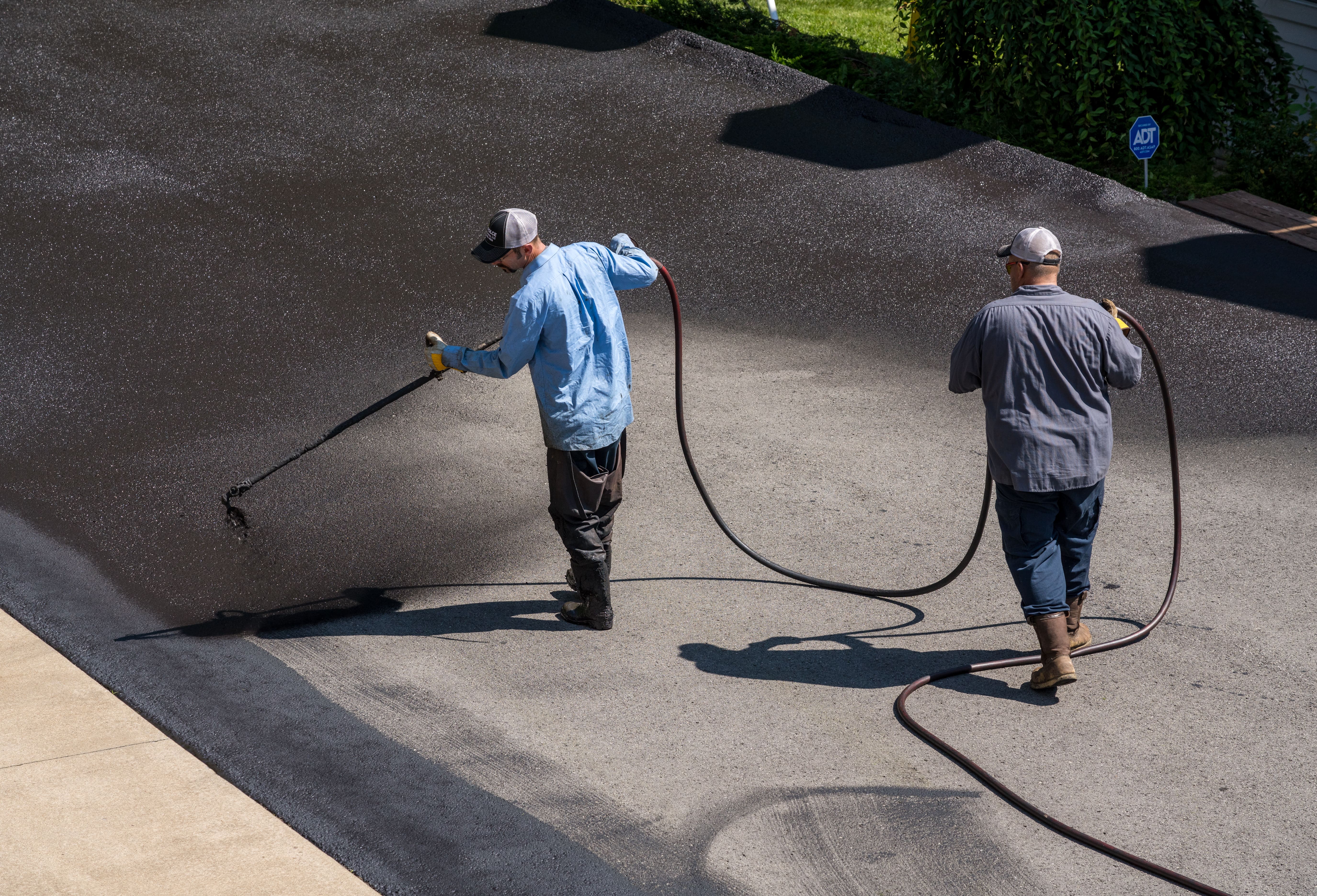 Nighttime road seal coating in progress with Gridmark’s professional team in Smithfield, Virginia, providing high-quality asphalt protection for government contracts in Suffolk, Newport News, and surrounding areas.