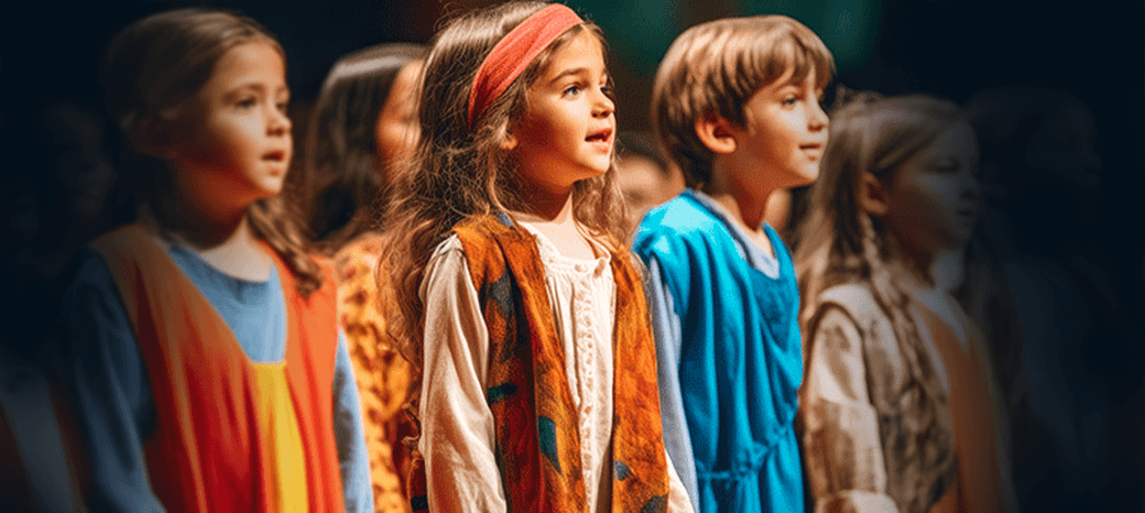 Kids practicing singing and acting skills in school-based musical theater class