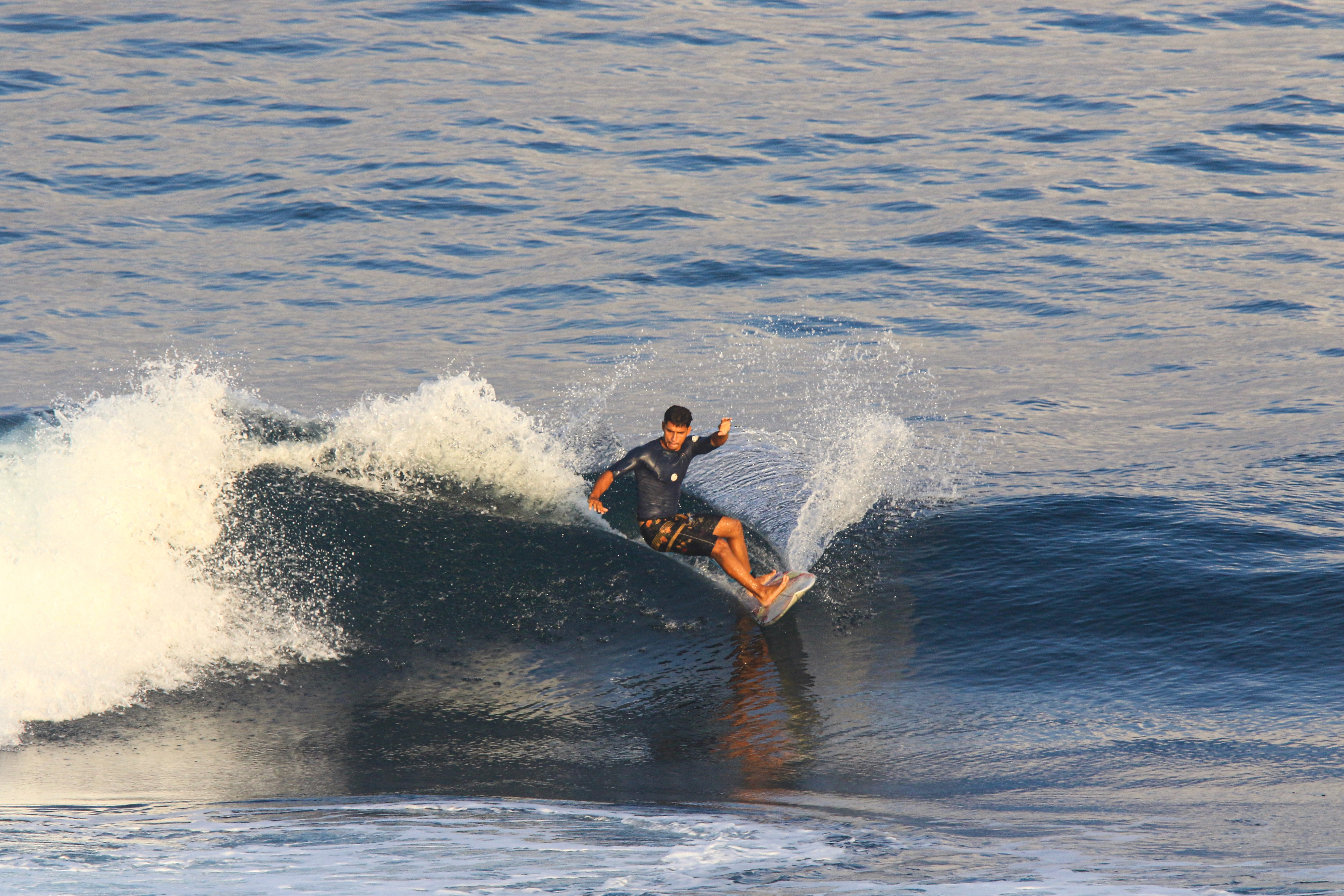 man surfing with big wave