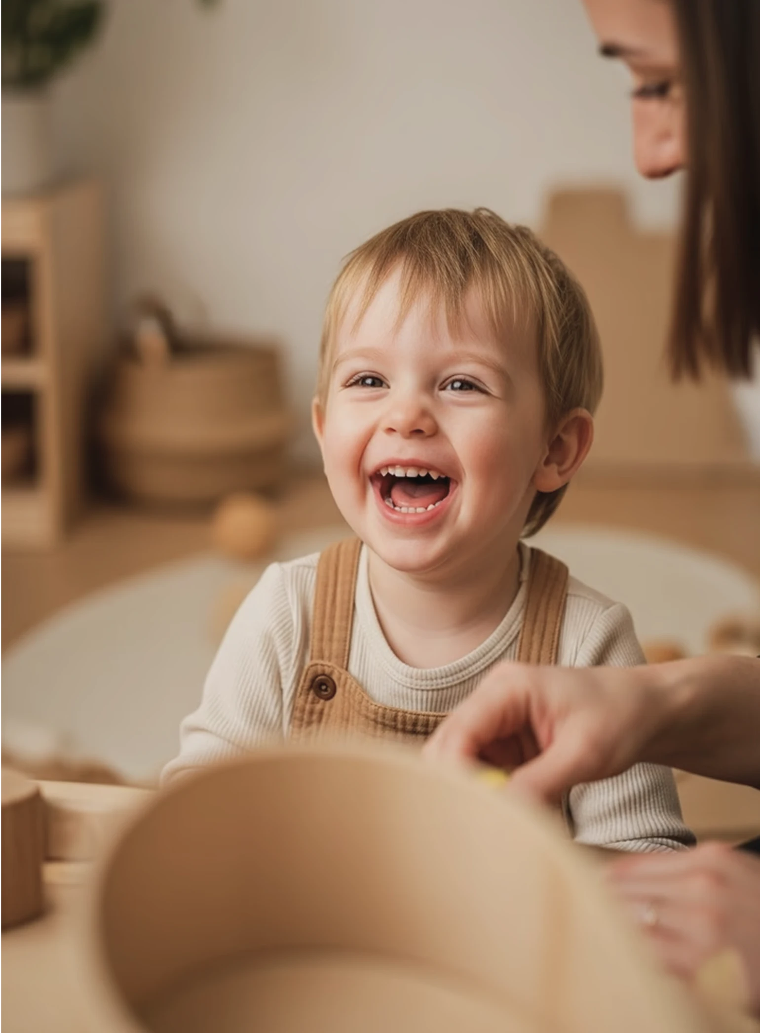 Smiling baby inside a kindergardent enviornment