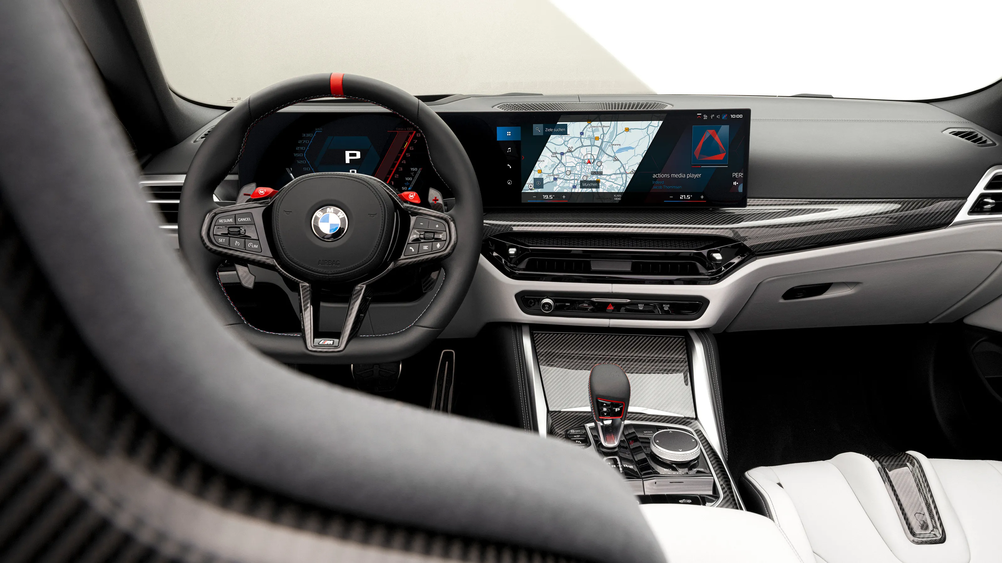Performance car interior with carbon fiber and red accents