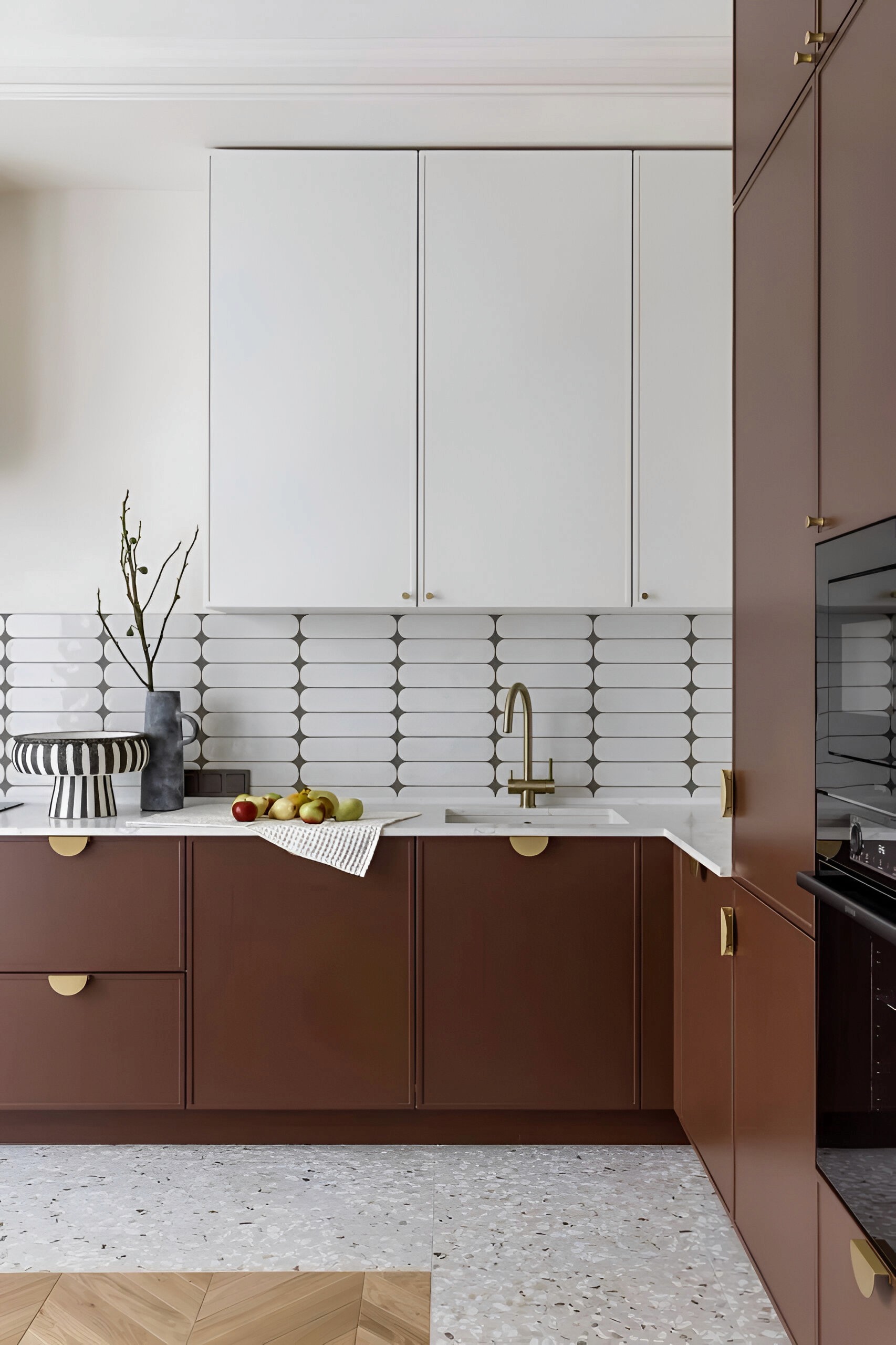 a kitchen with a sink and a stove top oven