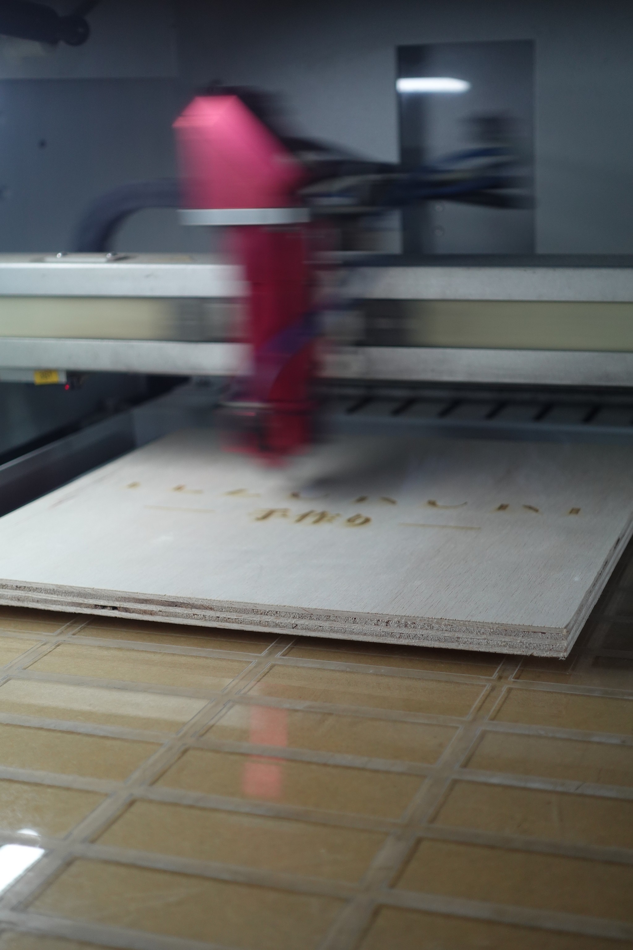 A high beam laser engraving machine engraving on a material