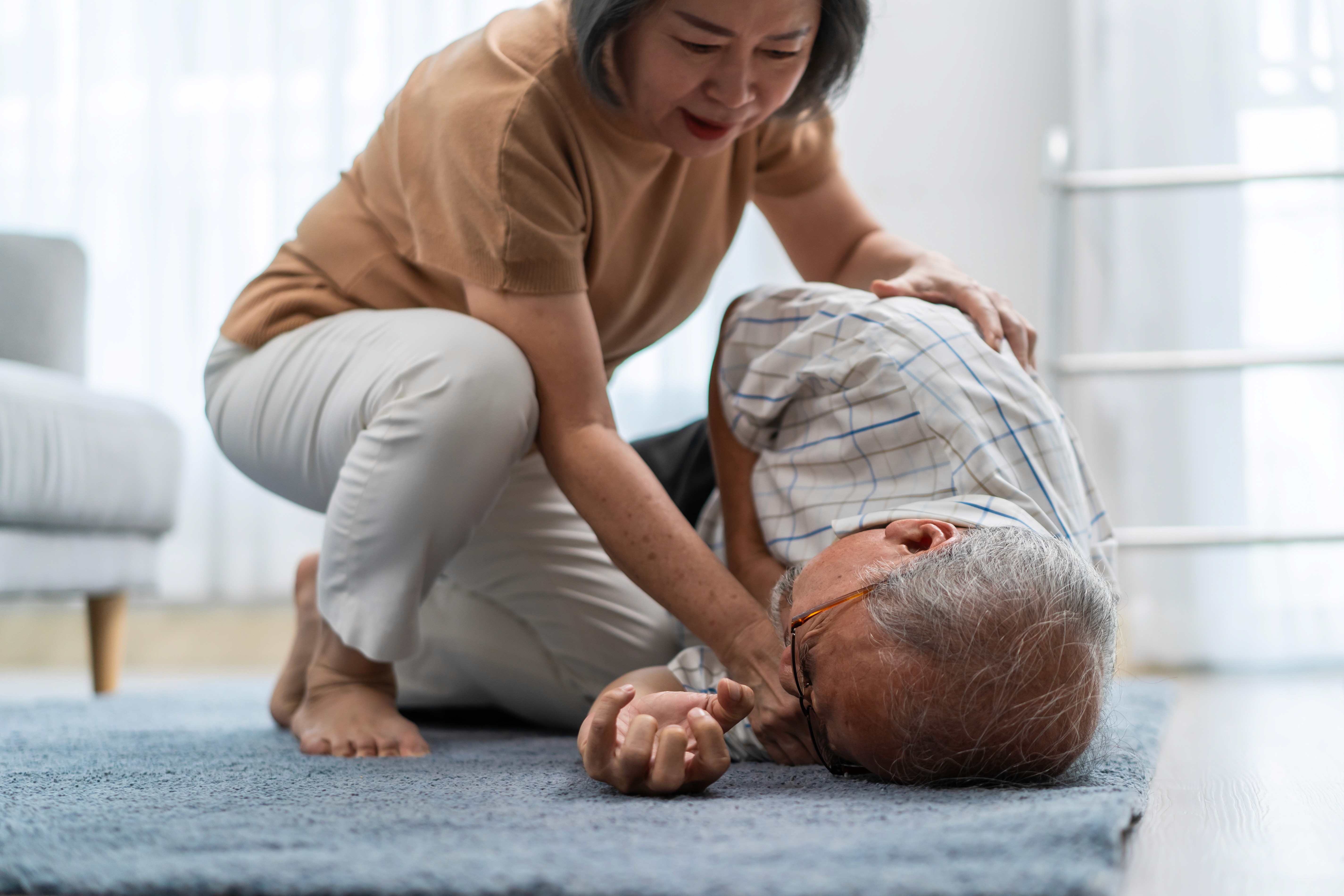 helping a person having a seizure on the floor