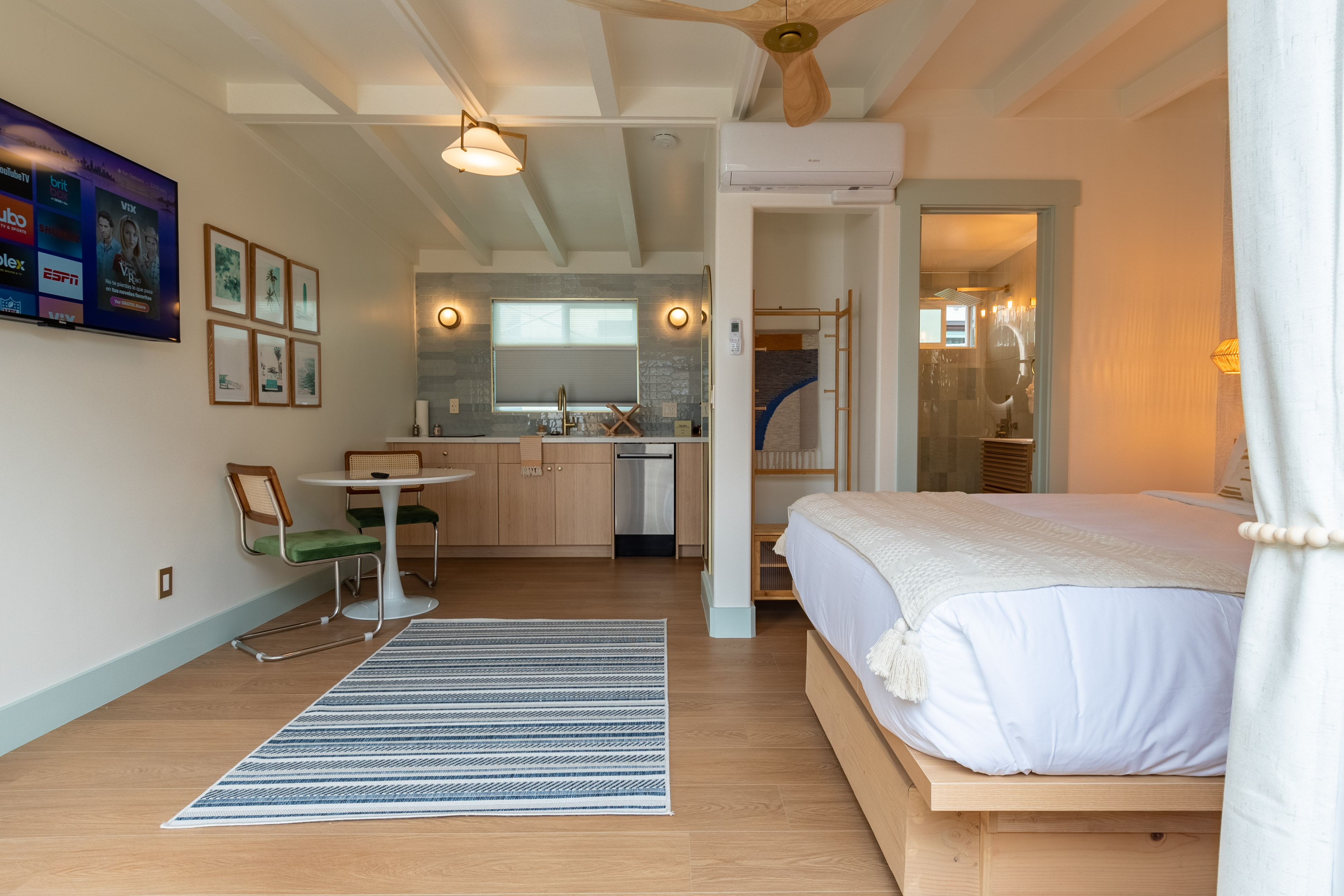 boats on seashore near houses