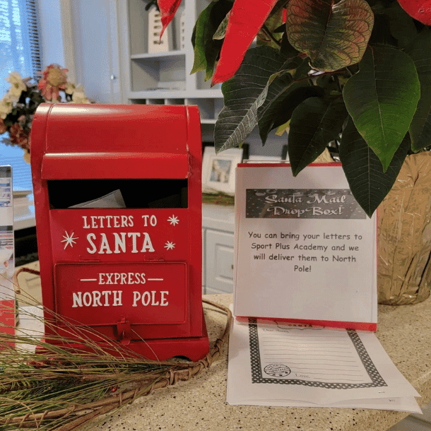 A letters to santa mailbox set up on the front desk at the SportPlus gym