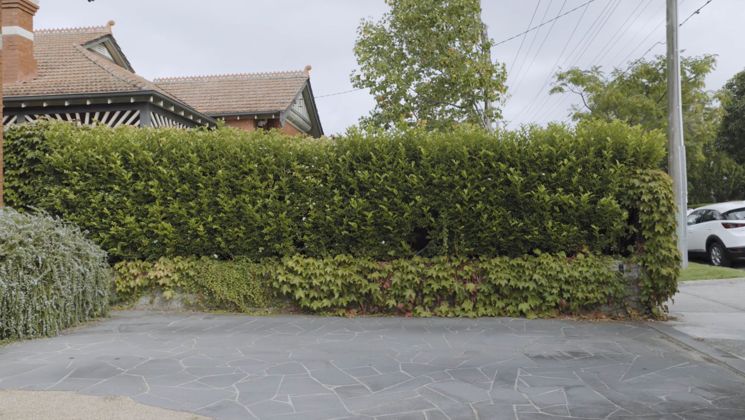 An empty driveway at a suburban residence