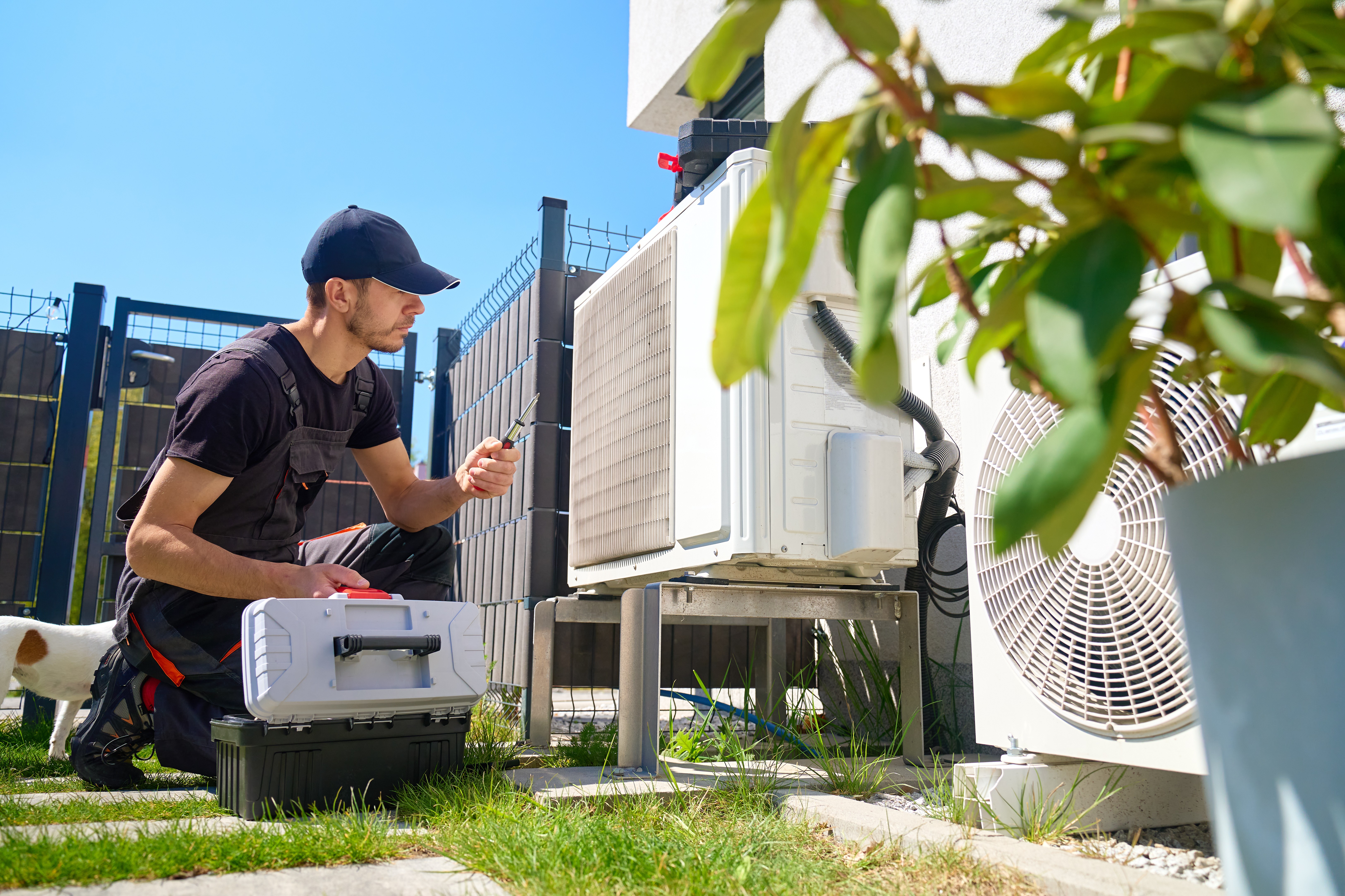 HVAC technician working outside in the sunshine