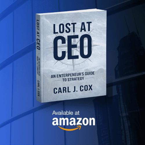 Modern interior space with a blue circular coffee table, flowers in a vase, and books neatly arranged.