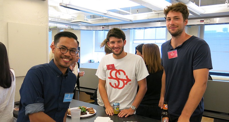 three students smiling